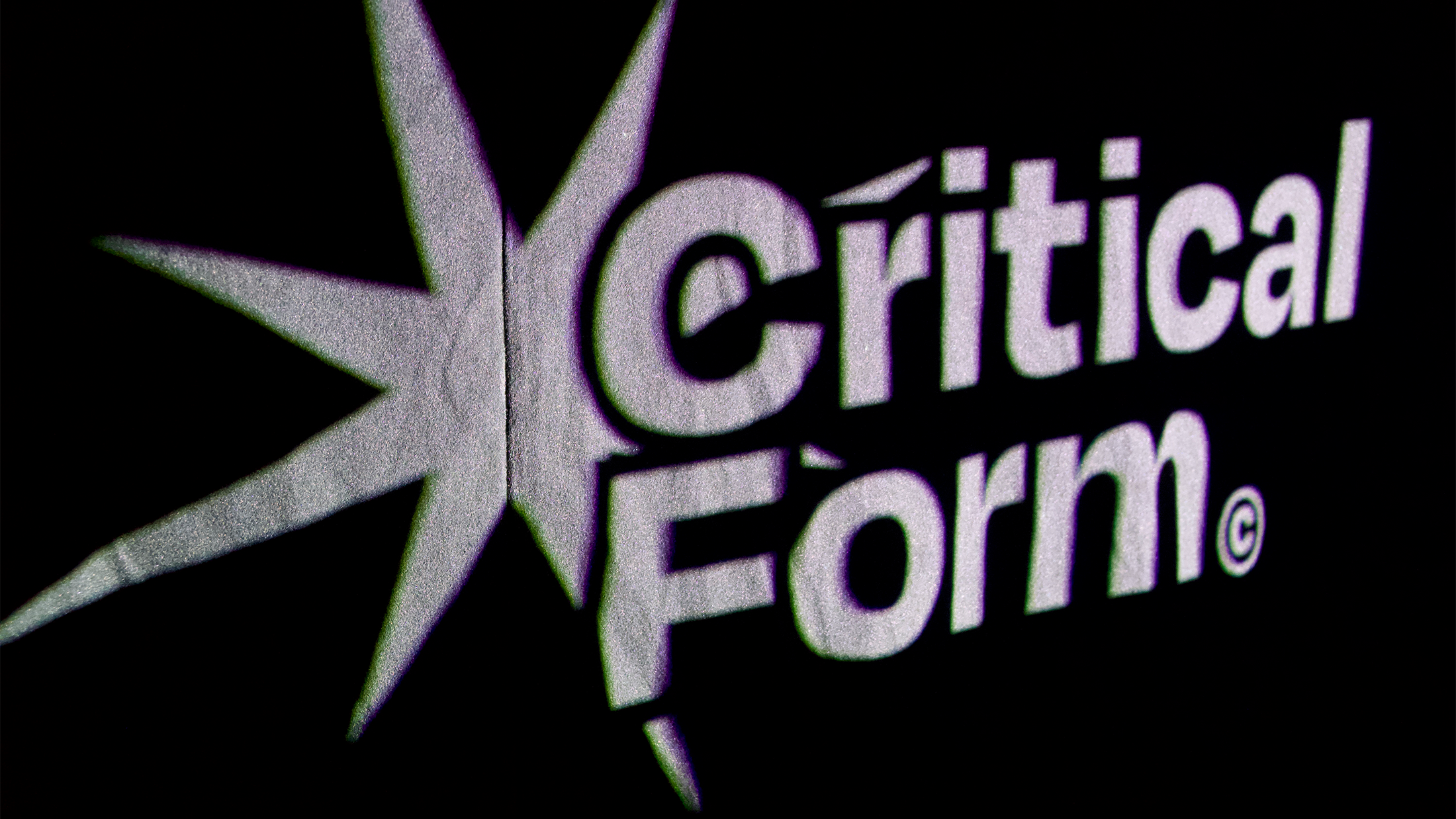 Logo wall projection from the pop-up event.