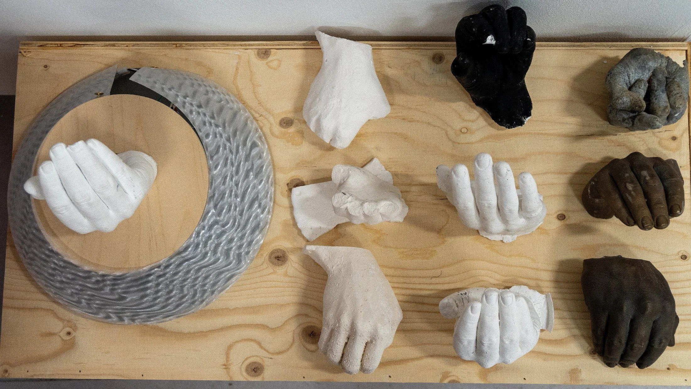 Hand casting experiments, failures and material tests, from fragile plaster to cold-cast bronze and iron.