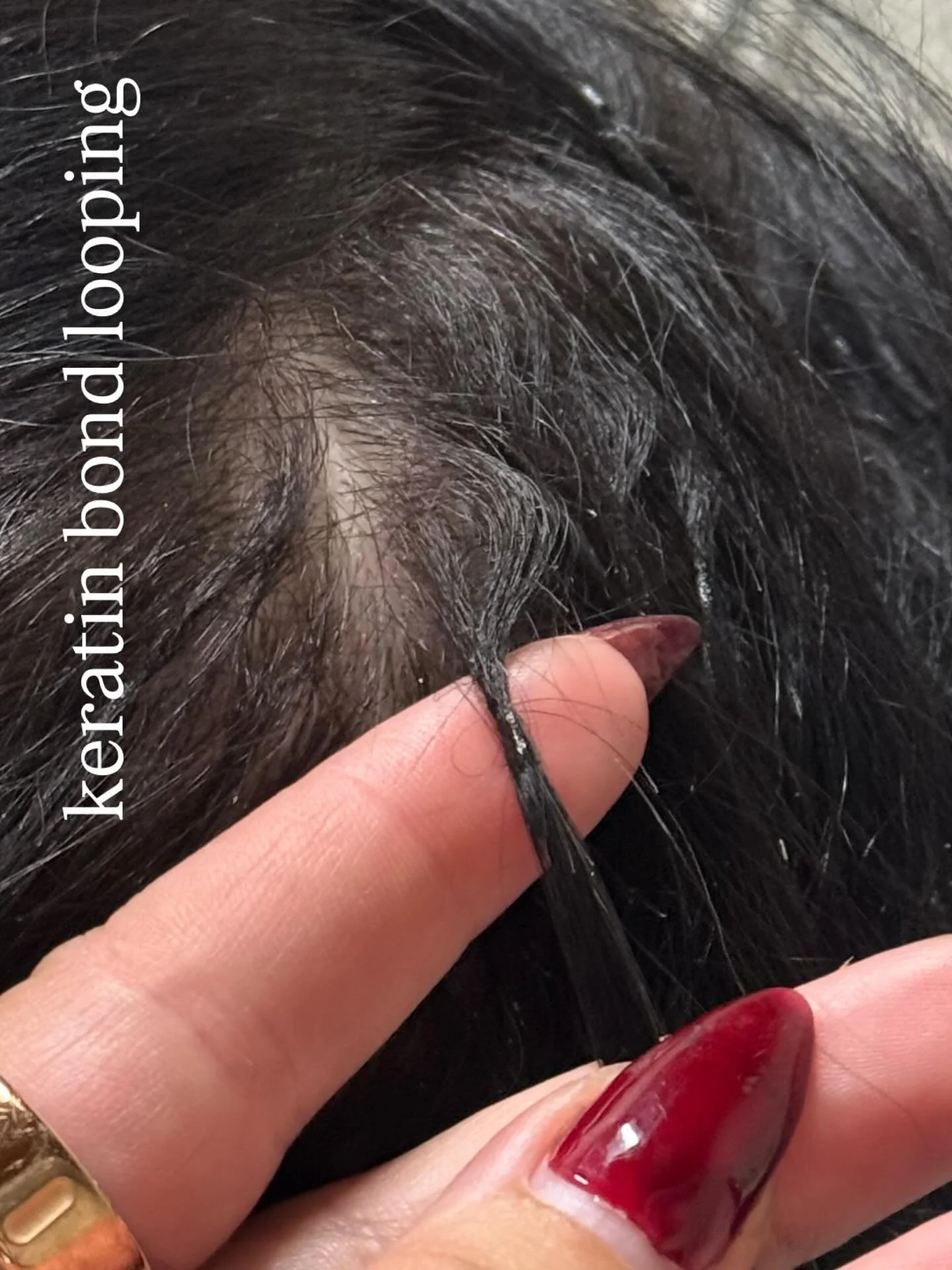 HOW I FIXED IT:

Keratin bond looping can happen while the hair grows. 

All of your hairs are not in the same growth cycle and some stands grow faster than others. 

to remedy this, I heated the bond and gently pulled down on the section without dis