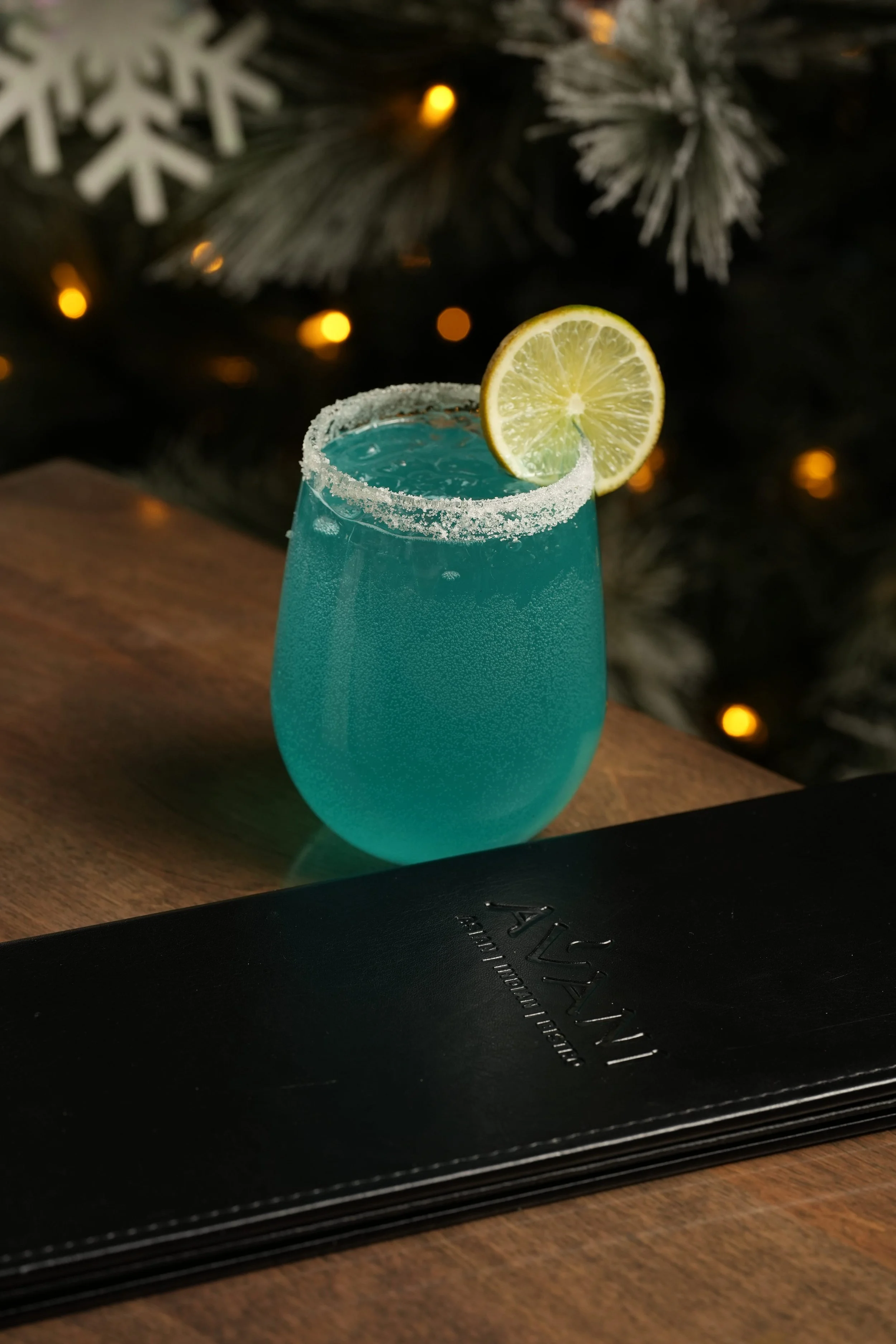 Frost Bite: Non-Alcoholic Blue Curacao with white cranberry juice and lemon-lime soda. One of the many delectable drinks offered in our Festive Drinks menu. 
