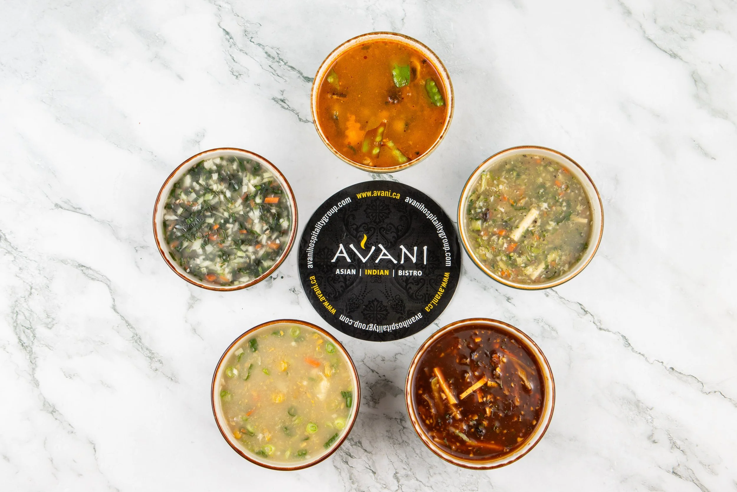 A showcase of the soups Avani has to offer, including customer favourites such as Hot & Sour Soup, Sweet Corn Soup, and House Soup. 