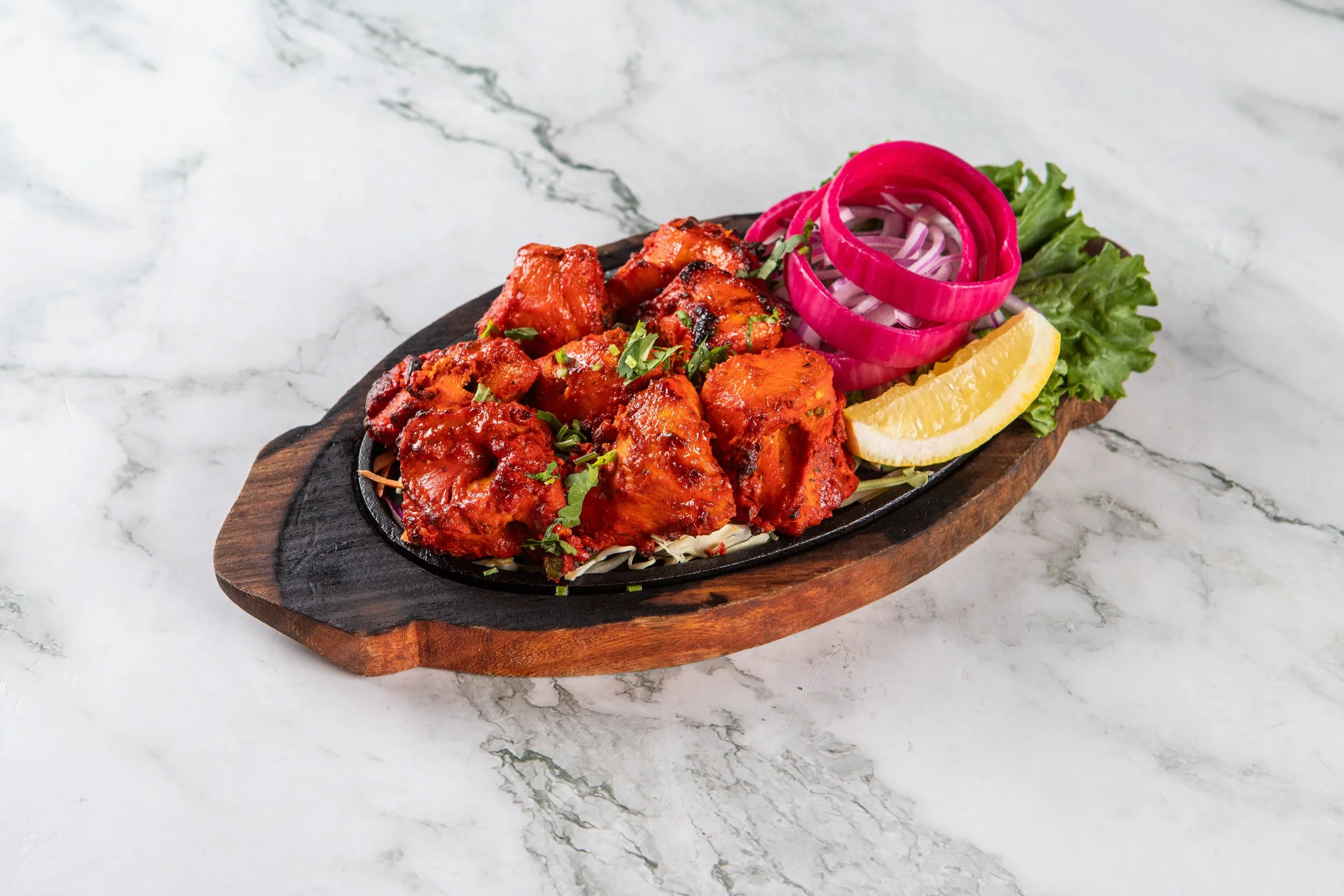 Chicken Tikka: Charbroiled chunks of boneless chicken marinated in yogurt and our Chef’s special spice blend.