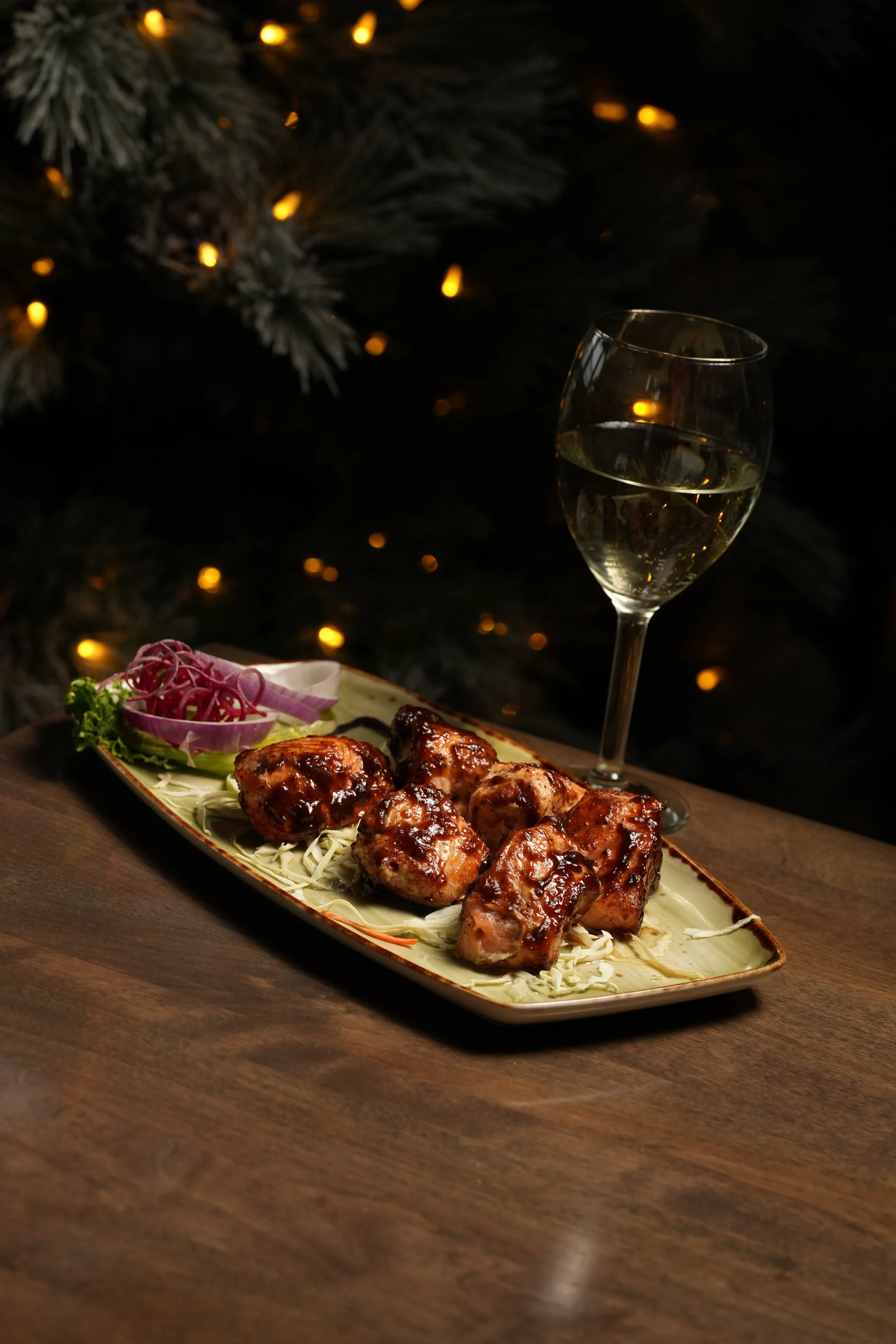 Maple Glazed Salmon: Soft, buttery fresh Atlantic salmon glazed in a maple and tamarind marinade, seasoned with 5 spice, and fire-roasted in tandoor. Festive Menu Starter