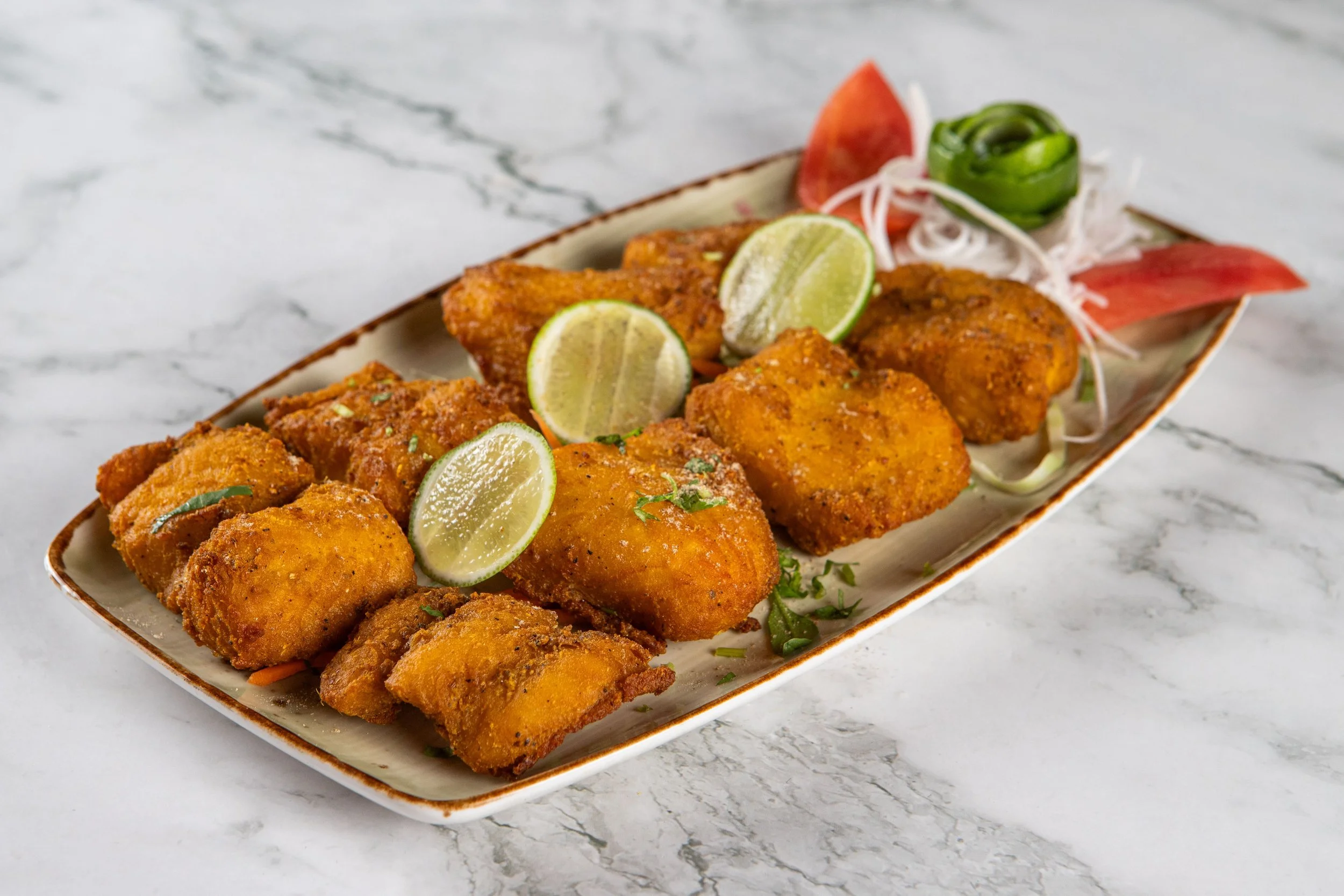Fish Pakora: Seasoned whitefish battered and fried crisp.