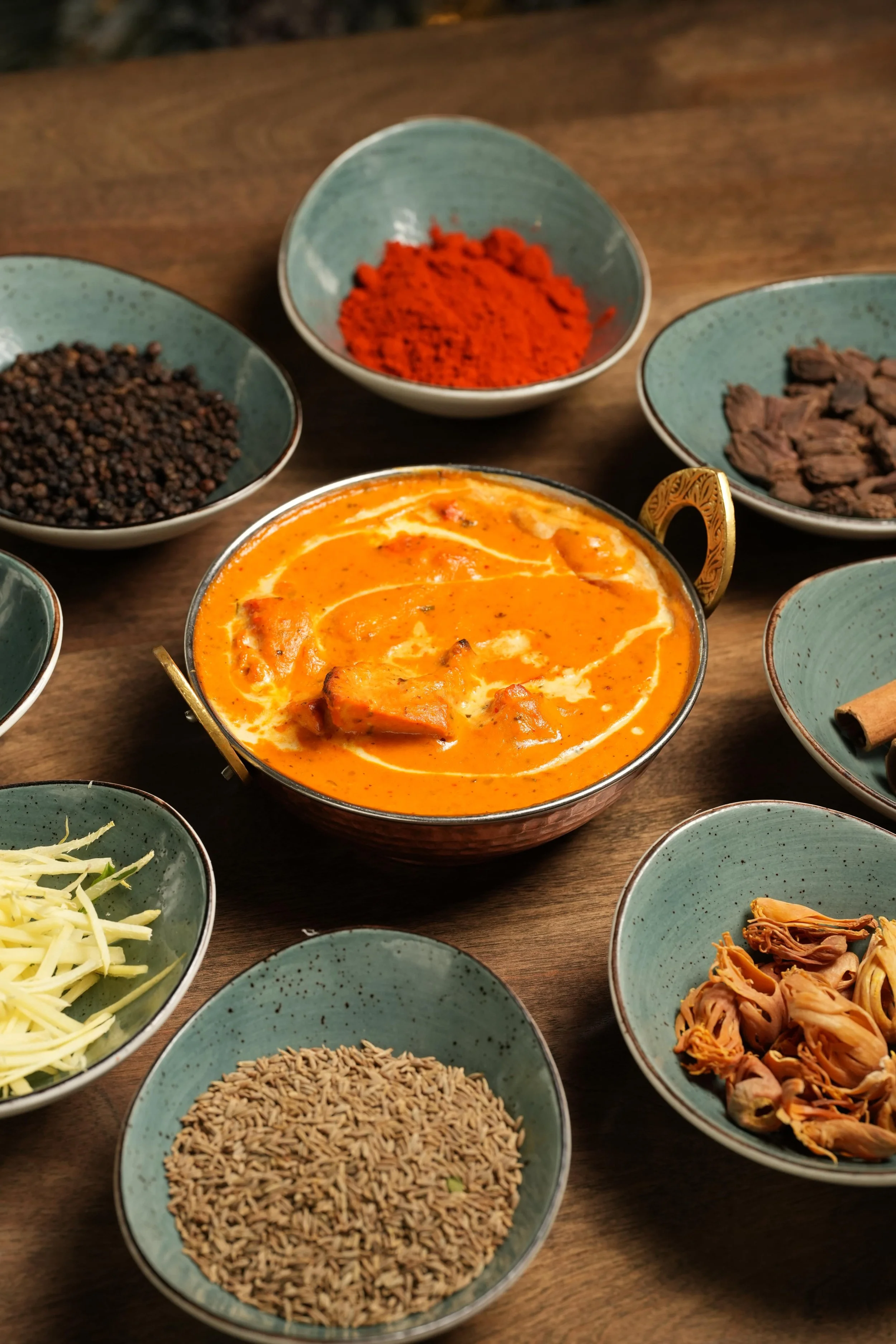 Badami Butter Chicken: Tandoori Chicken simmered in a creamy almond-tomato gravy enriched with saffron and cardamom for a festive twist on the best butter chicken in the GTA. 