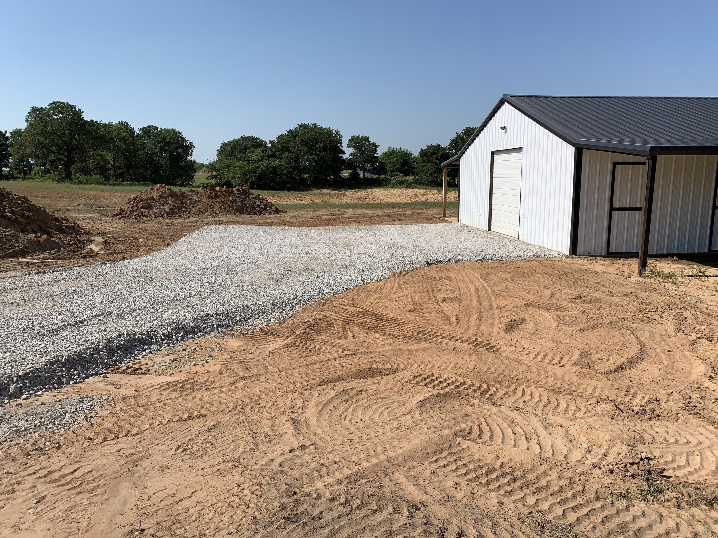 Metal Building With Gravel Driveway
