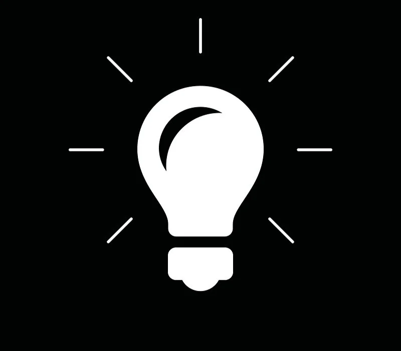 White light bulb icon with rays on a black background, symbolizing an idea or innovation.