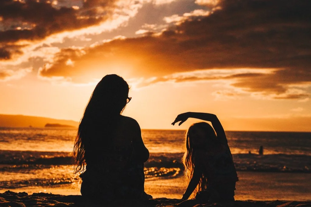 A mom having a moment with her daughter sharing why she needs to obey. Photography by Guille Pozzi