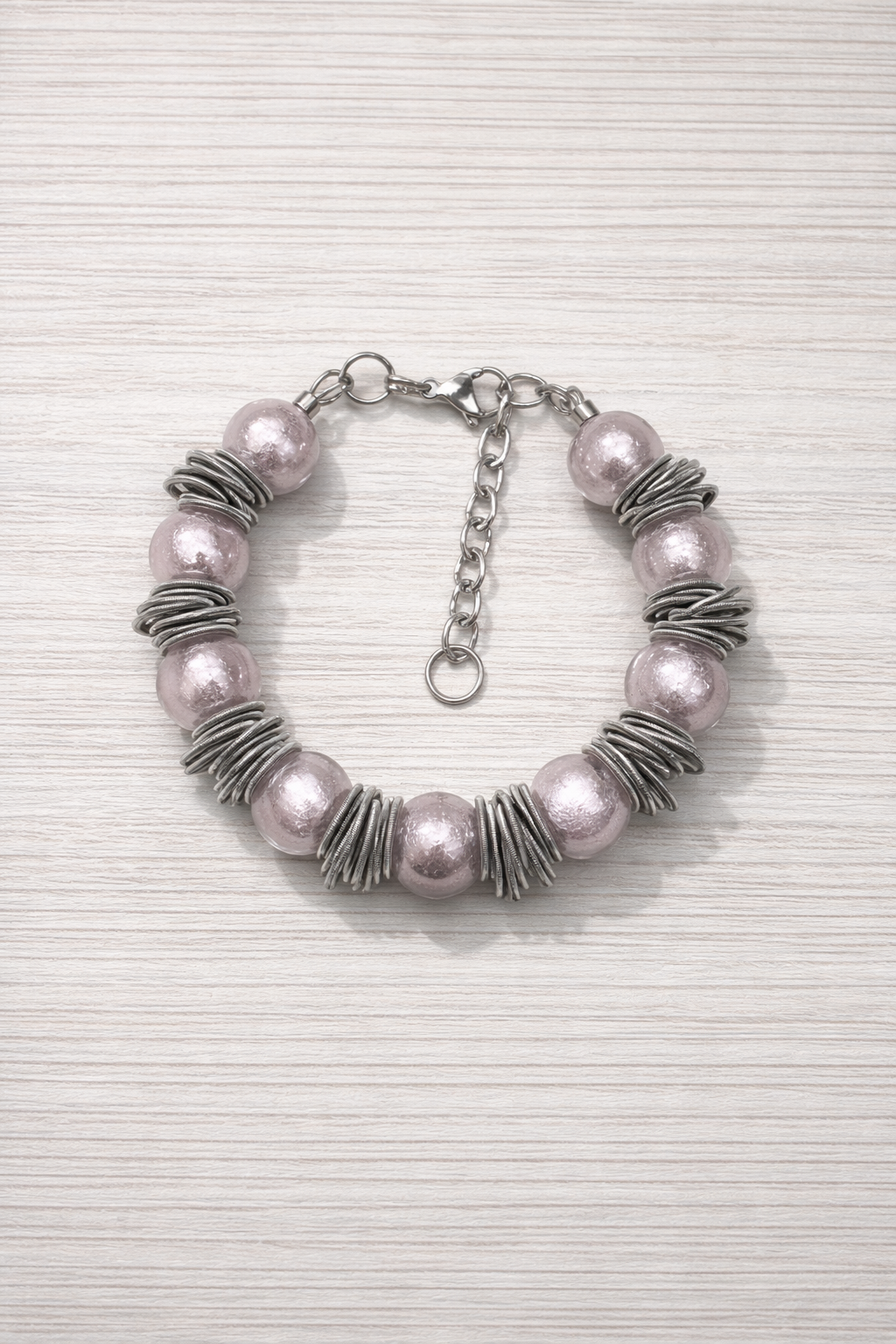 Braccialetto Ø12 bantù rosa trasparente.PNG