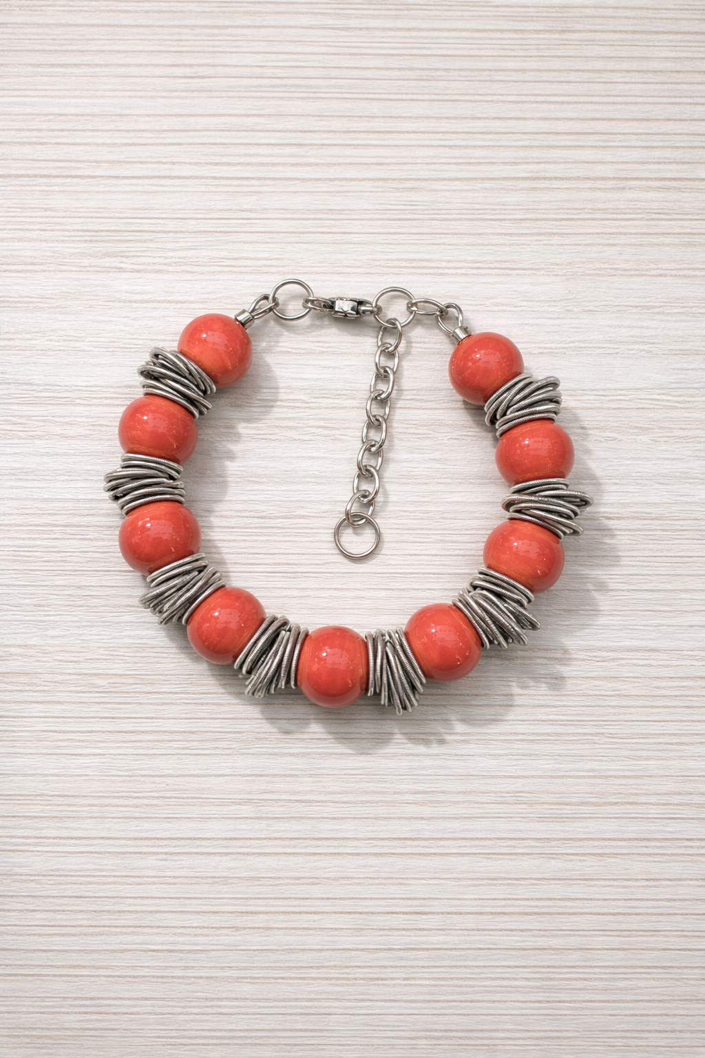 Braccialetto Ø12 bantù corallo.PNG