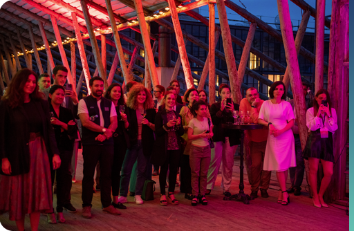 Image of people at an outdoor outing in the evening.