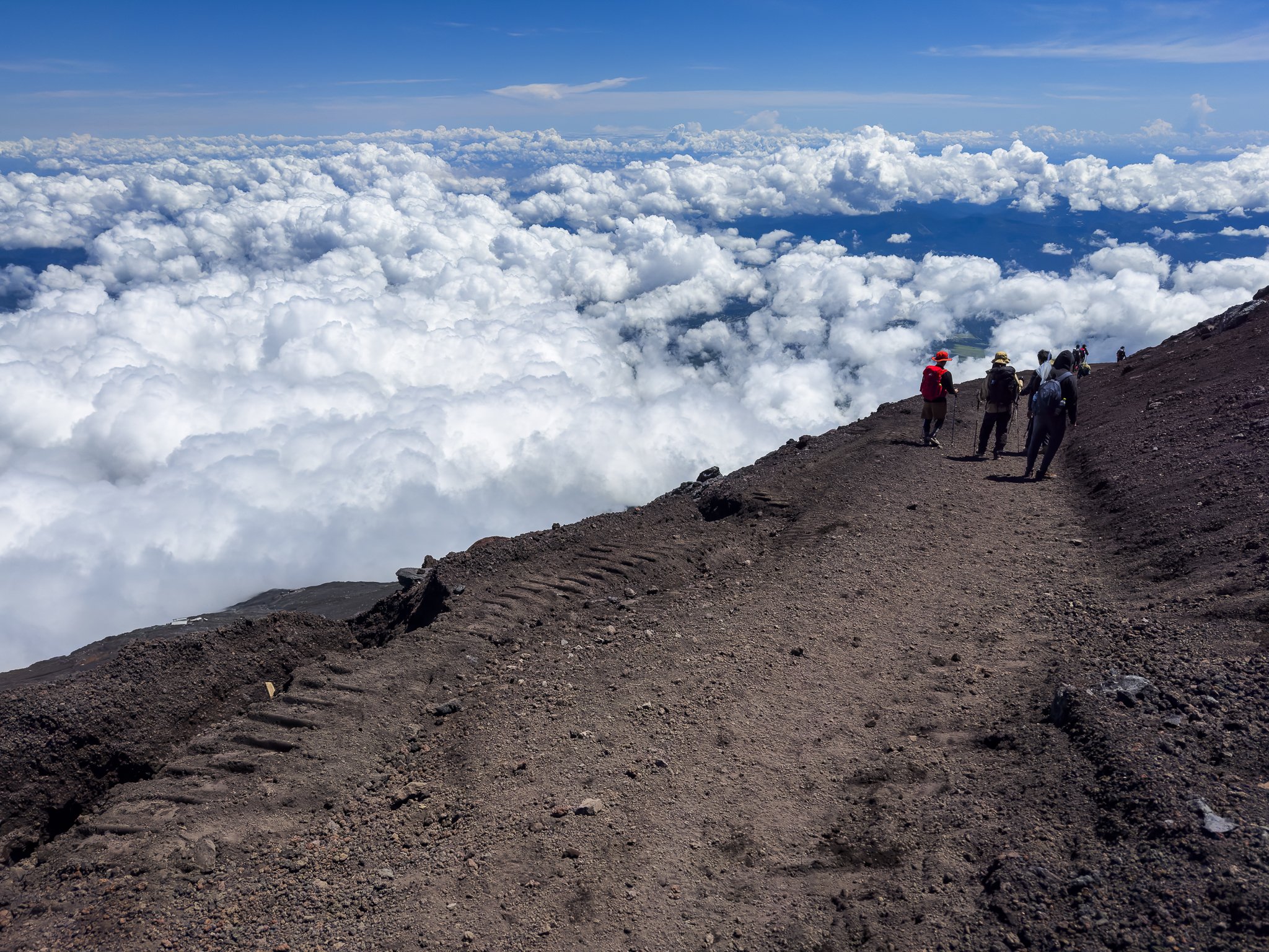 Climbers on Mount Fuji above the Clouds