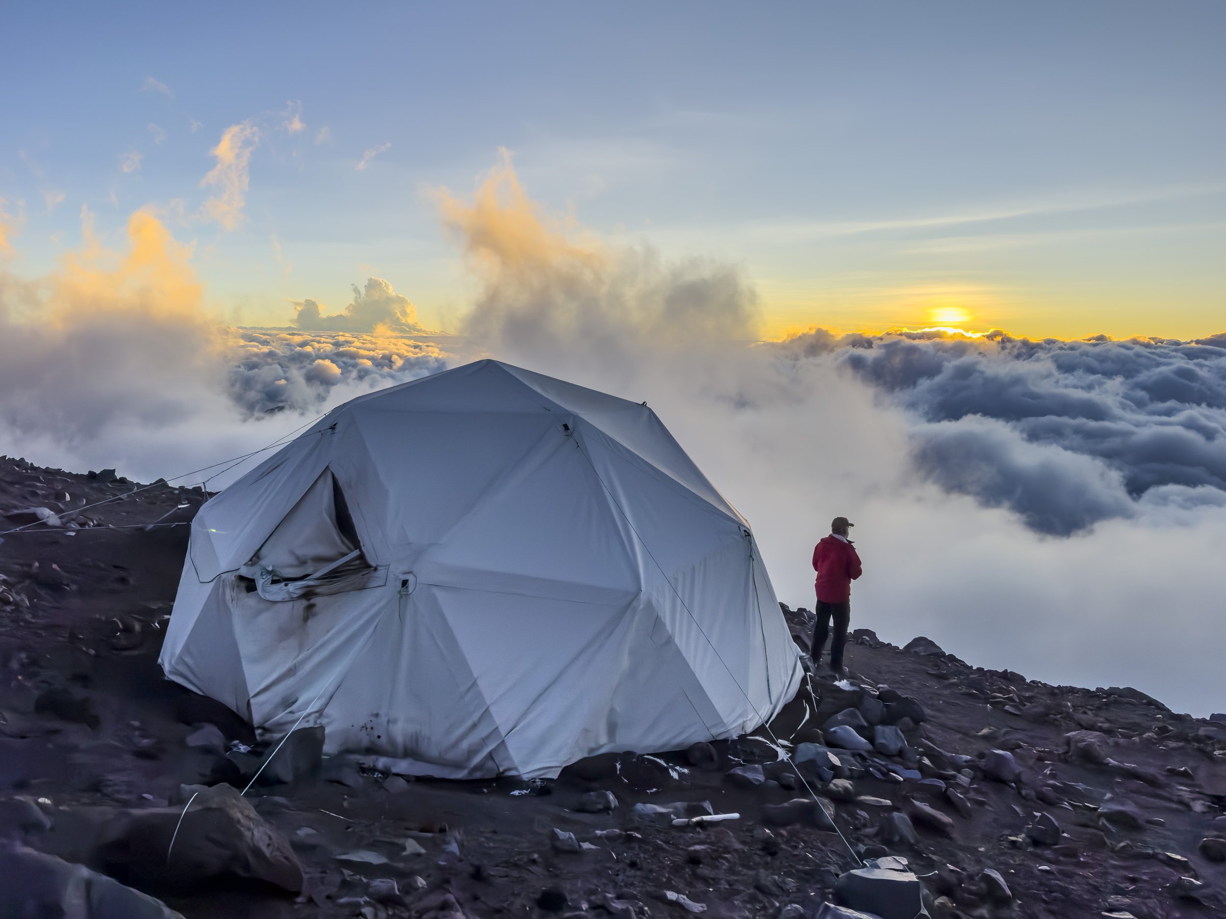 Mountaineer looking at the sunset outside of the basecamp kitchen tent on Mount Chimborazo, Ecuador
Shot on iPhone 14 Pro