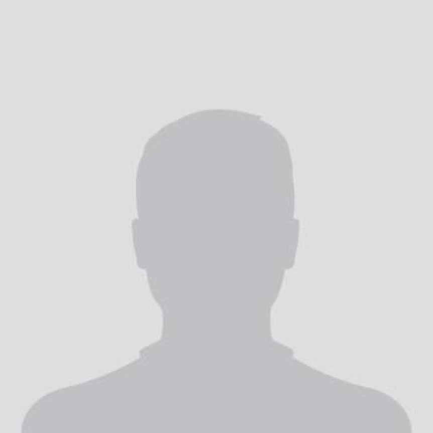 Silhouette of a person's head and shoulders against a plain background.