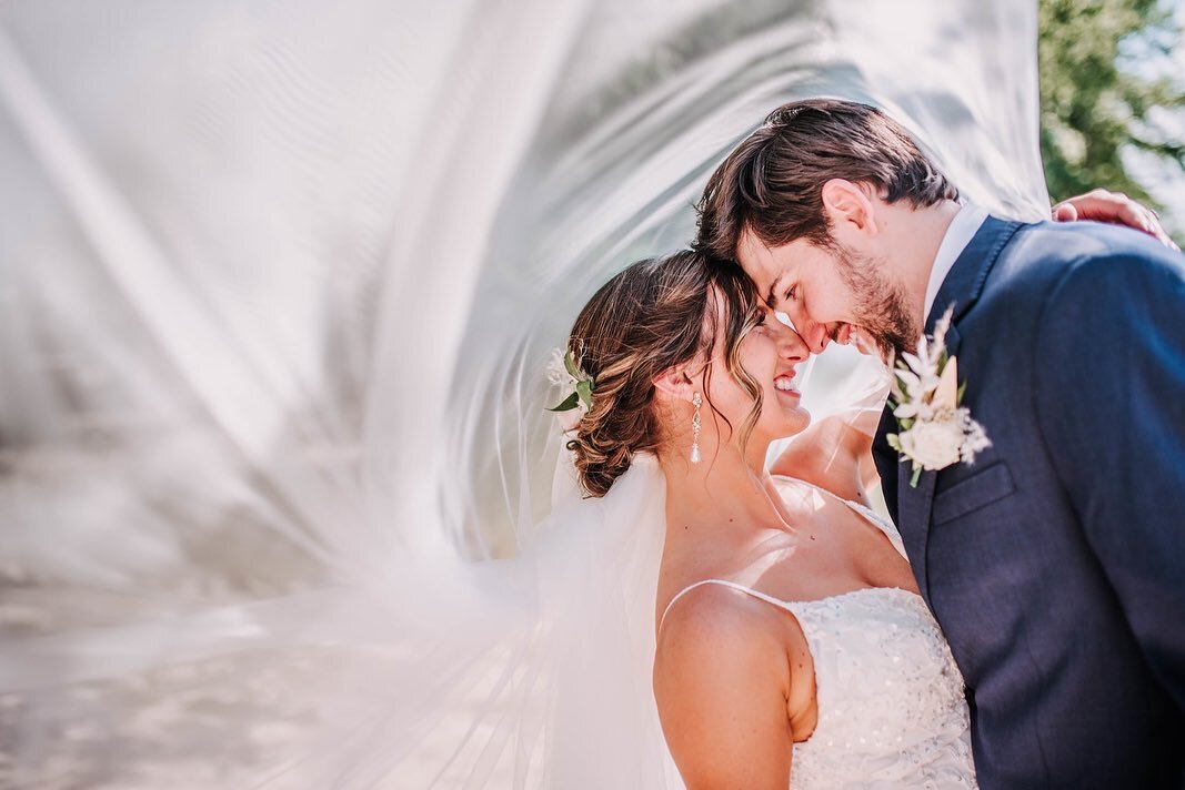 Never miss the chance for those veil shots. Goodness gracious, I just love this bride and groom so, so much, and their day was about as perfect as it gets, y&rsquo;all! @huntervalleypav never disappoints and was the perfect boho beach meets lake view