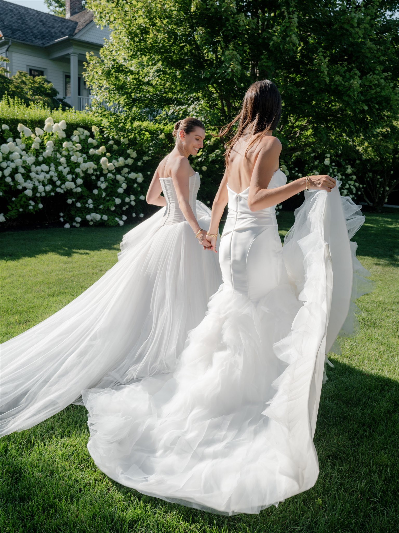 two brides hand in hand romantic bridal gowns beth chapman styling