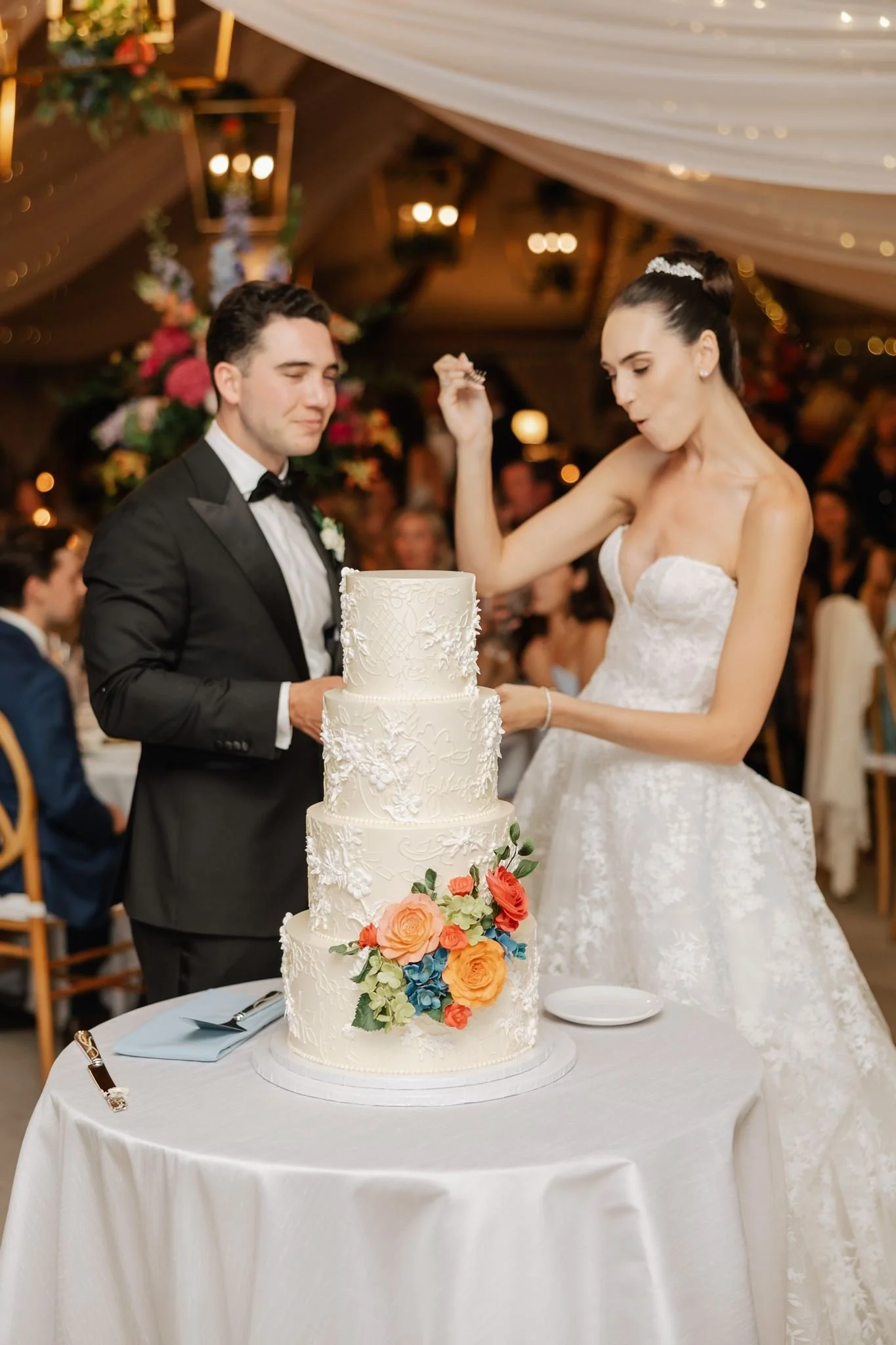 bride and groom cut cake wedding reception beth chapman styling