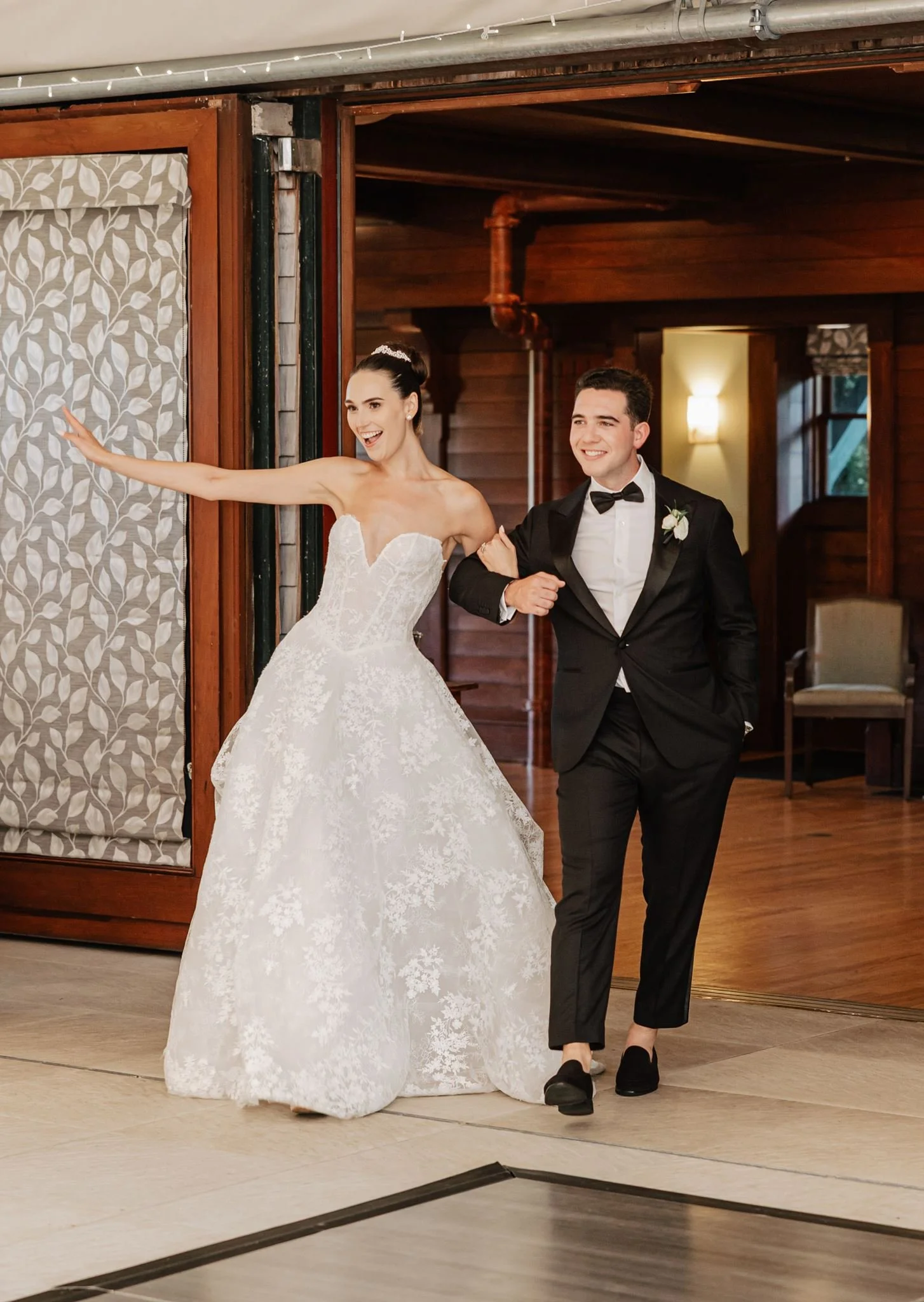 bride and groom enter wedding reception strapless elegant ines di santo gown beth chapman styling