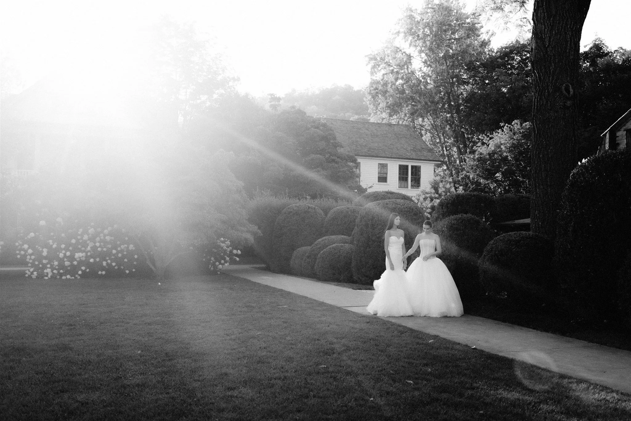 two brides couple stunning wedding gowns beth chapman styling