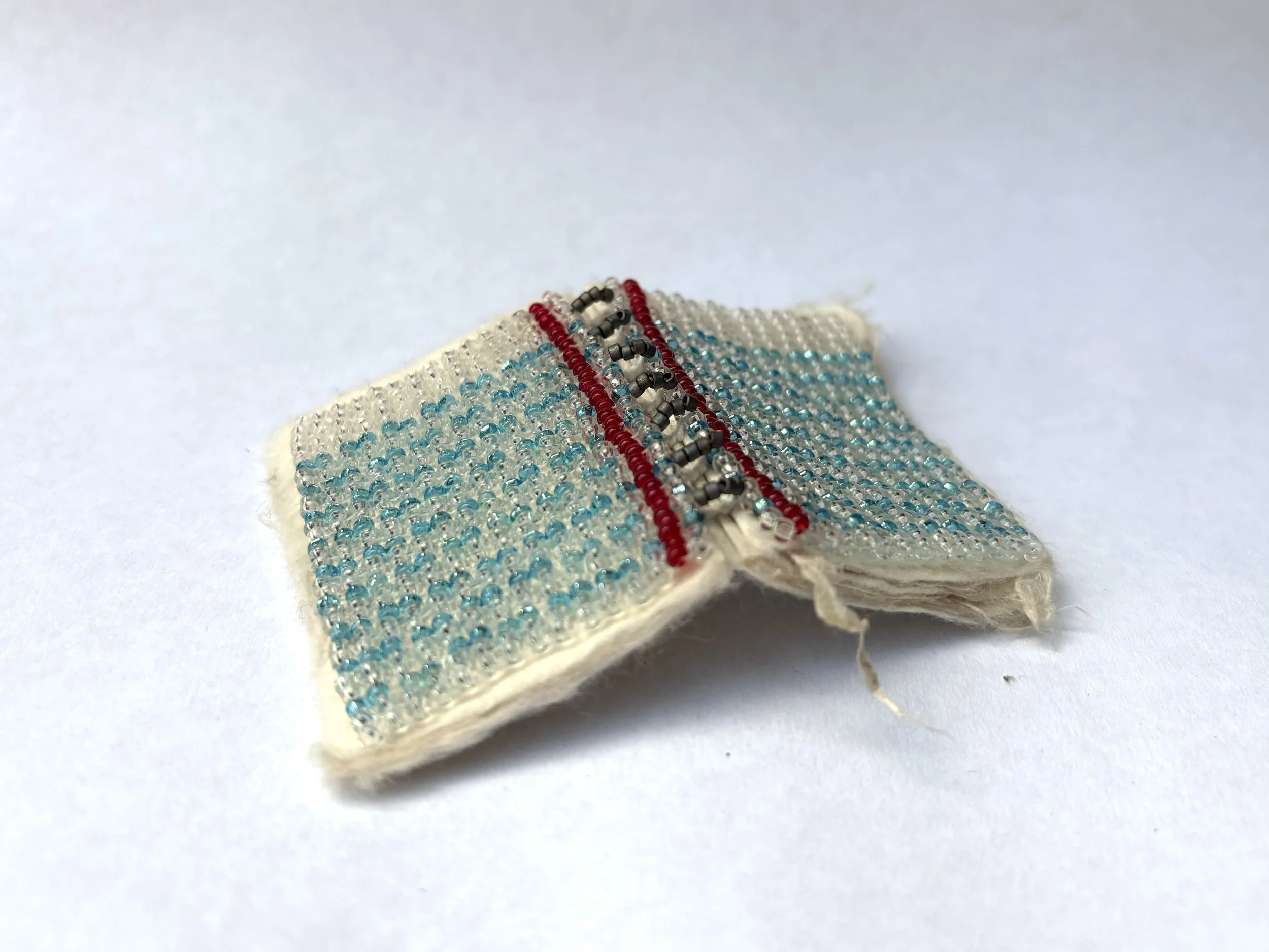 Notebook. Iowa Kozo and Thai Kozo in hand bound book with seed bead cover and spine, 1.5x2in, 2026. 