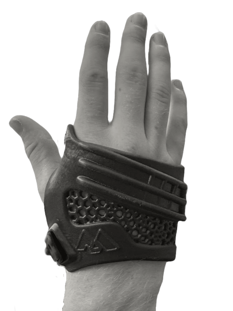 A black and white photo of a hand wearing a textured black glove with velcro, holding the back of the hand facing the viewer against a dark background.