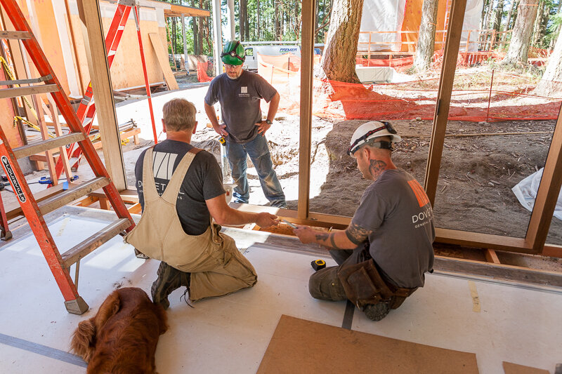  Larry Bower, Joel Jaynes, and Chris Rion set the Brombal Windows in place.  