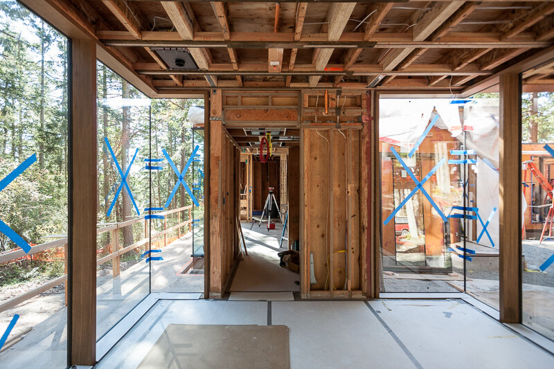 During construction, the windows are set and the concrete floors are protected.  
