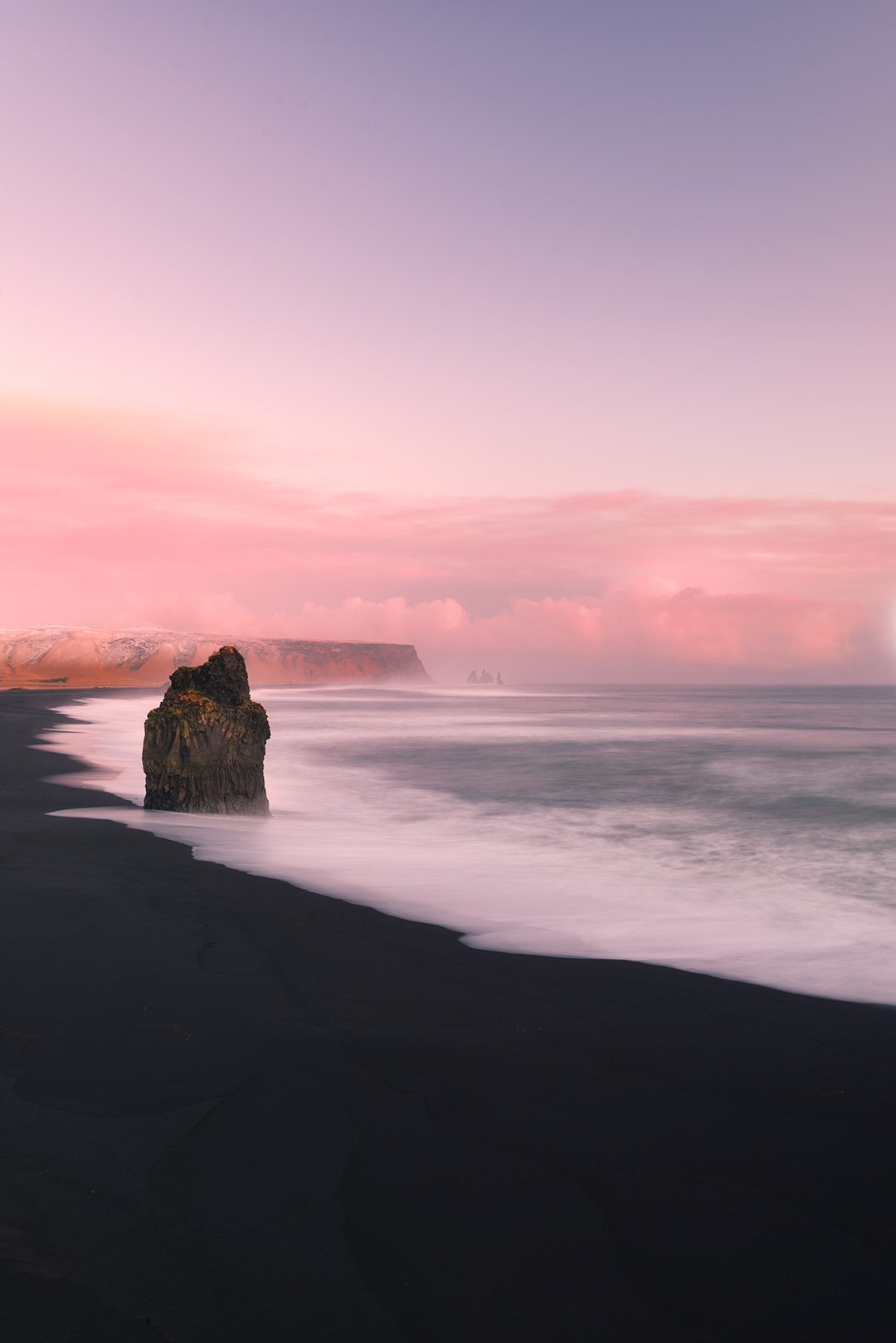 Arnardrangur 'The Eagle Rock,' Iceland: Stunning Coastal Landscape, Pink Sunrise, Iconic Rock Formation.
  Coastal, Golden Hour  
