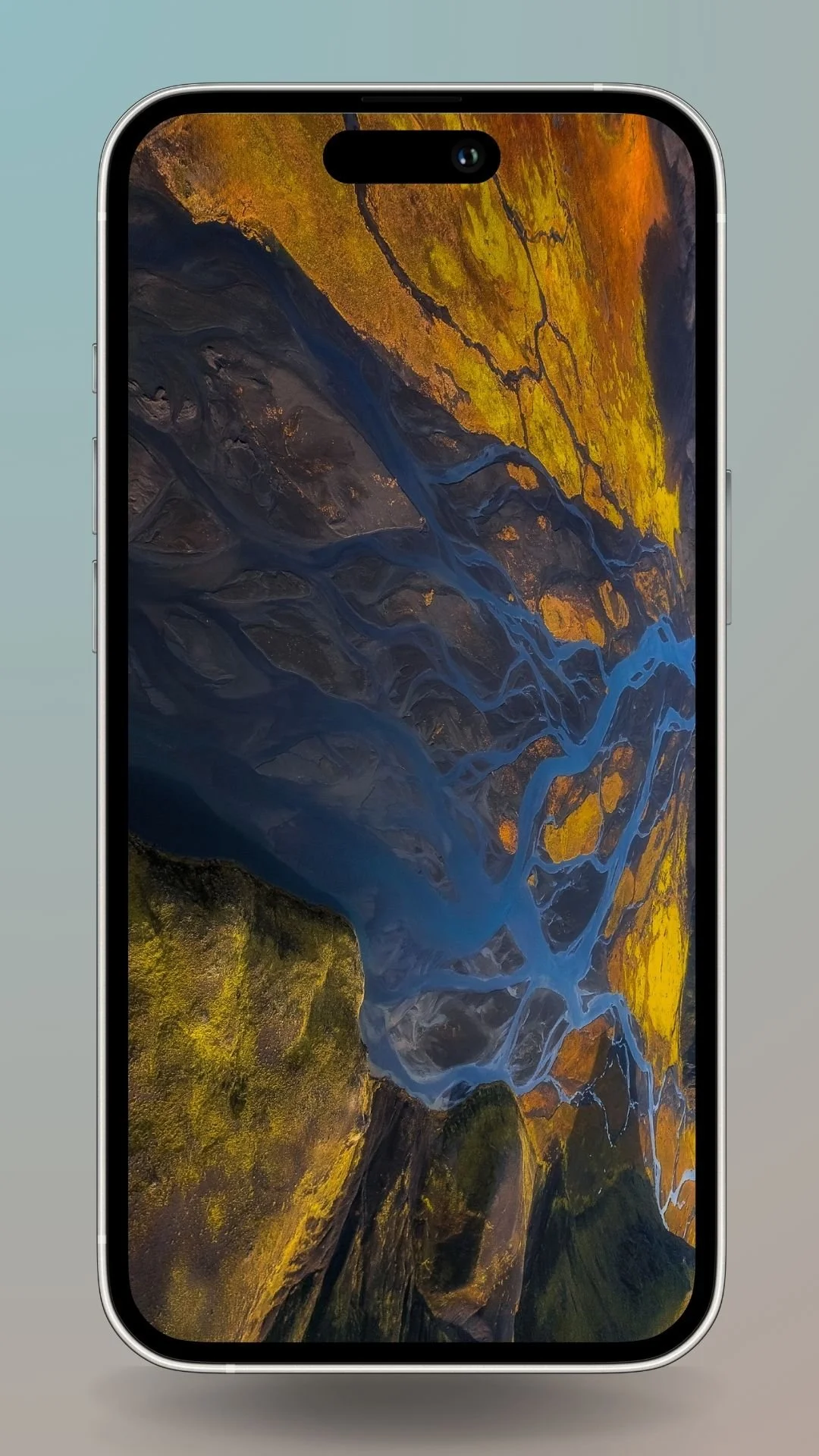 Aerial view of Iceland's colorful river delta with flowing blue streams and golden landscape.