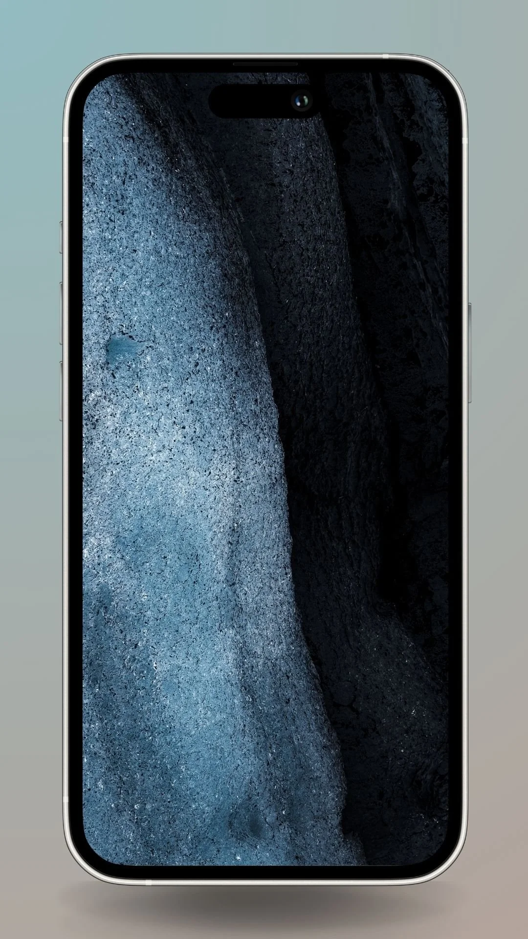 Moody Icelandic scene with deep blue and black textured rock formations.