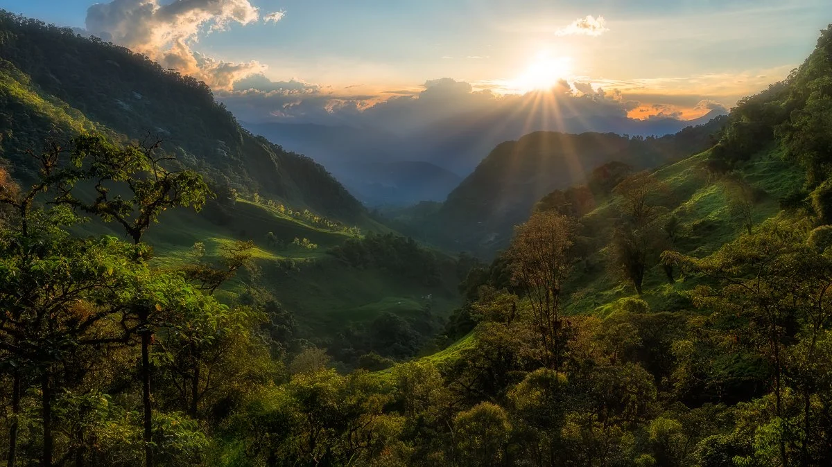Stunning Final View at the 7 Cascades Hike in Jardin, Colombia: Sunset Over Lush Green Valleys, Majestic Mountain Landscape, Adventure Travel Photography.
  Golden Hour, Light  