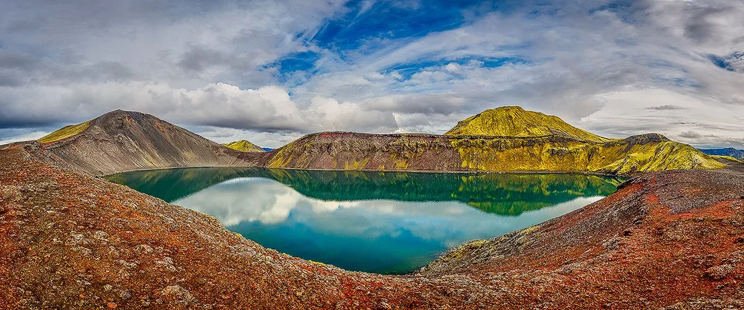 Panoramic view of Ljotipollur, a stunning crater lake in the highlands of Iceland, showcasing vibrant colors and dramatic landscapes.
  Panoramic, Cold,  