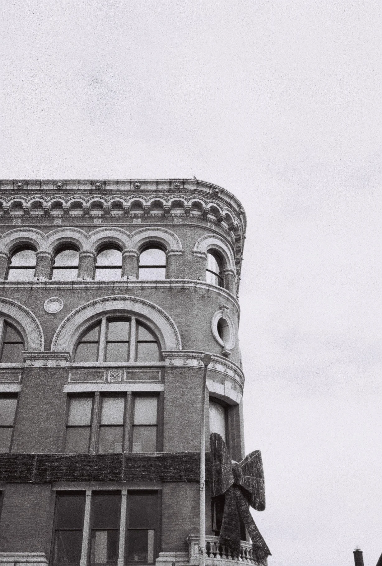 Gift-wrapped building in Troy, NY. Taken with Pentax 17. ISO 1600.