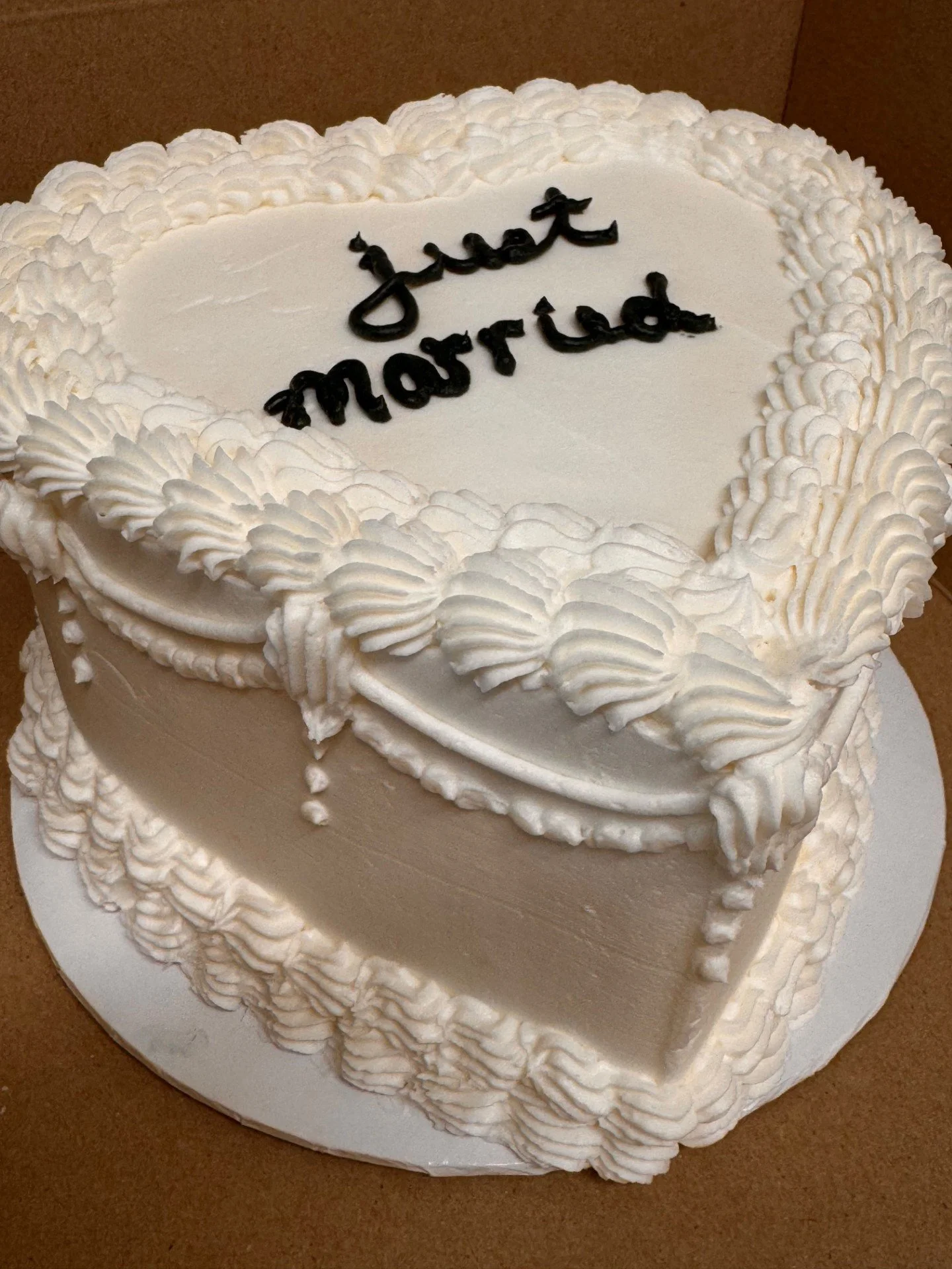 heart shaped just married cake with Lambeth style icing