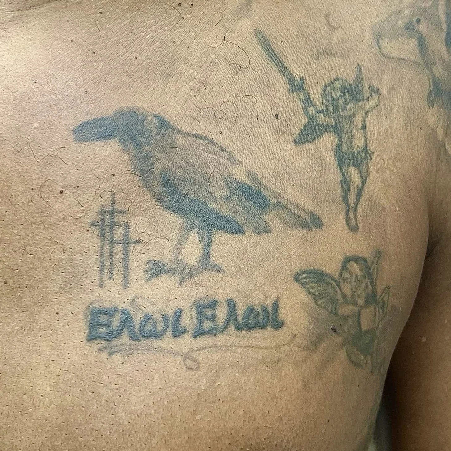 Before: Old bird and text tattoos on chest