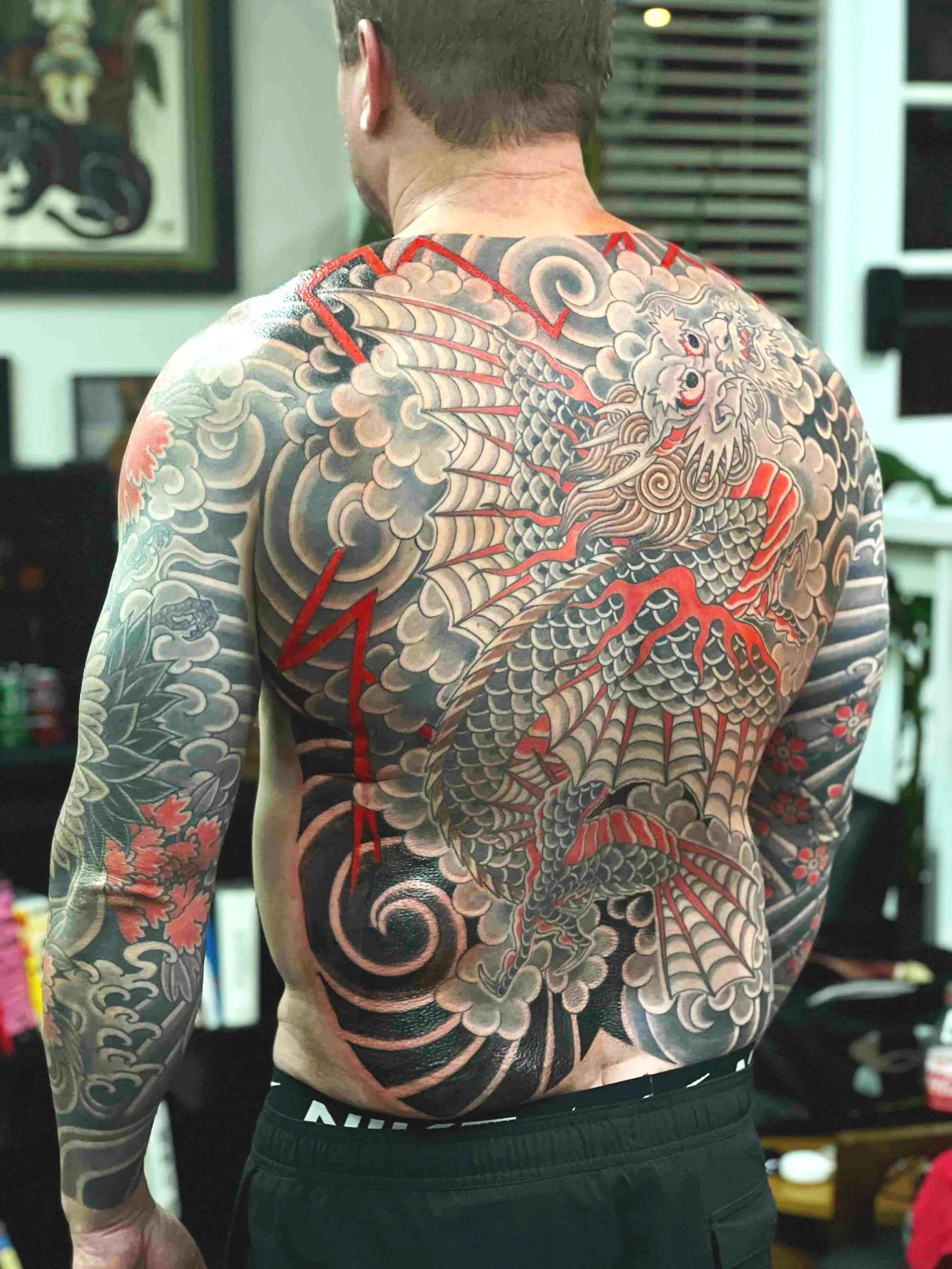 Japanese flying dragon backpiece and healed sleeves by Wes Holland in Atlanta, GA