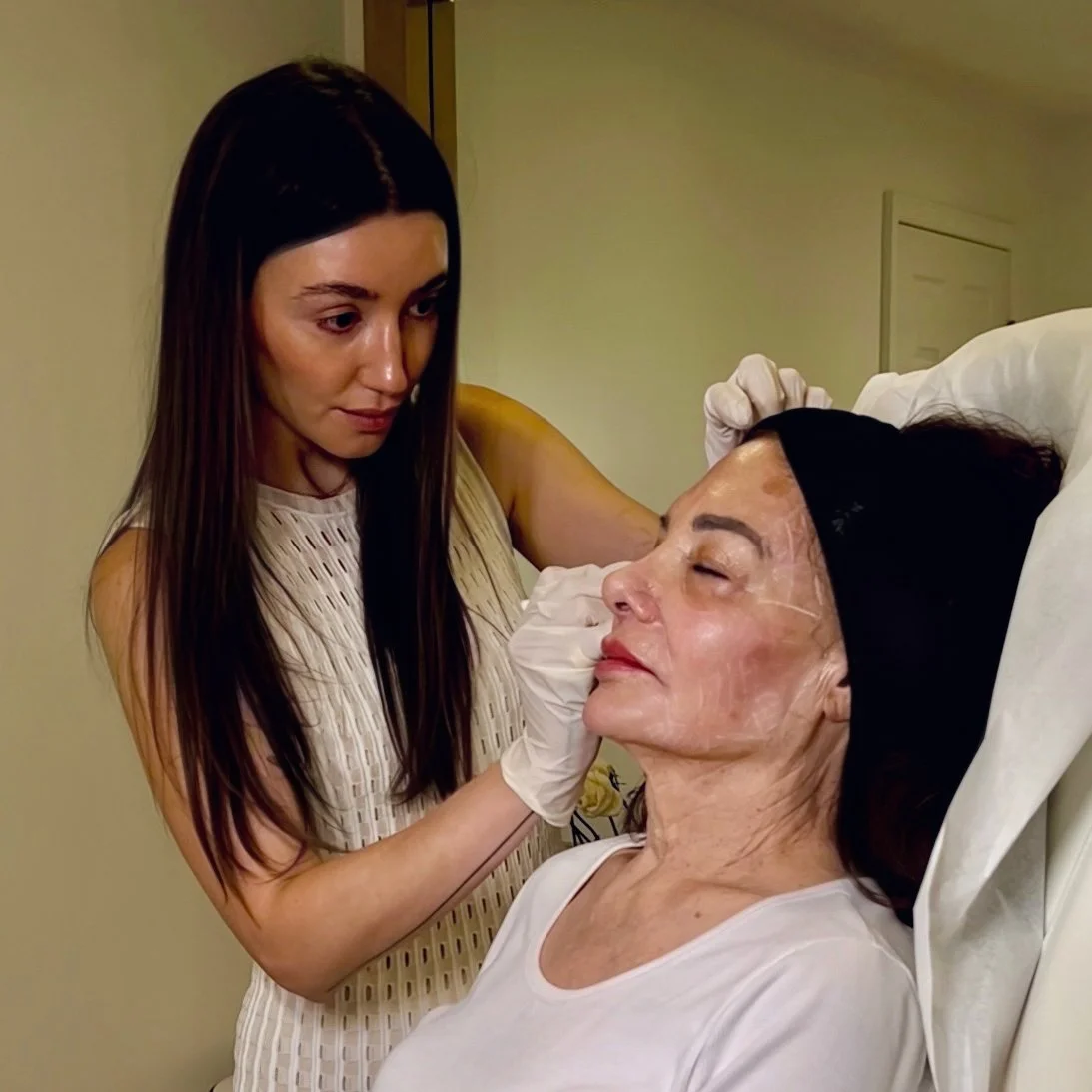 Marina Zakhrabova, aesthetic nurse injector in NYC, performing an aesthetic treatment on a patient