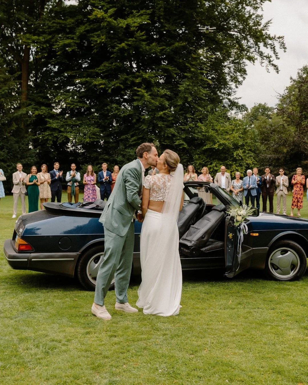 When your bride shows up in a dress with cutouts at the waist/a half crop top situation, you just know it&rsquo;s going to be a stylish wedding. I love a bold choice 🤩

And then there was the family obsession: a retro Saab. Convertible, of course. W