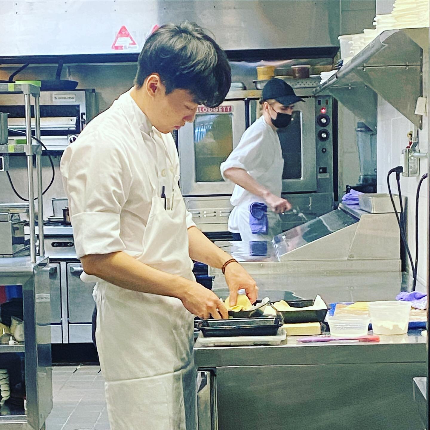 Chef Yeongsoo and Chef Chris hard at work on a new dish