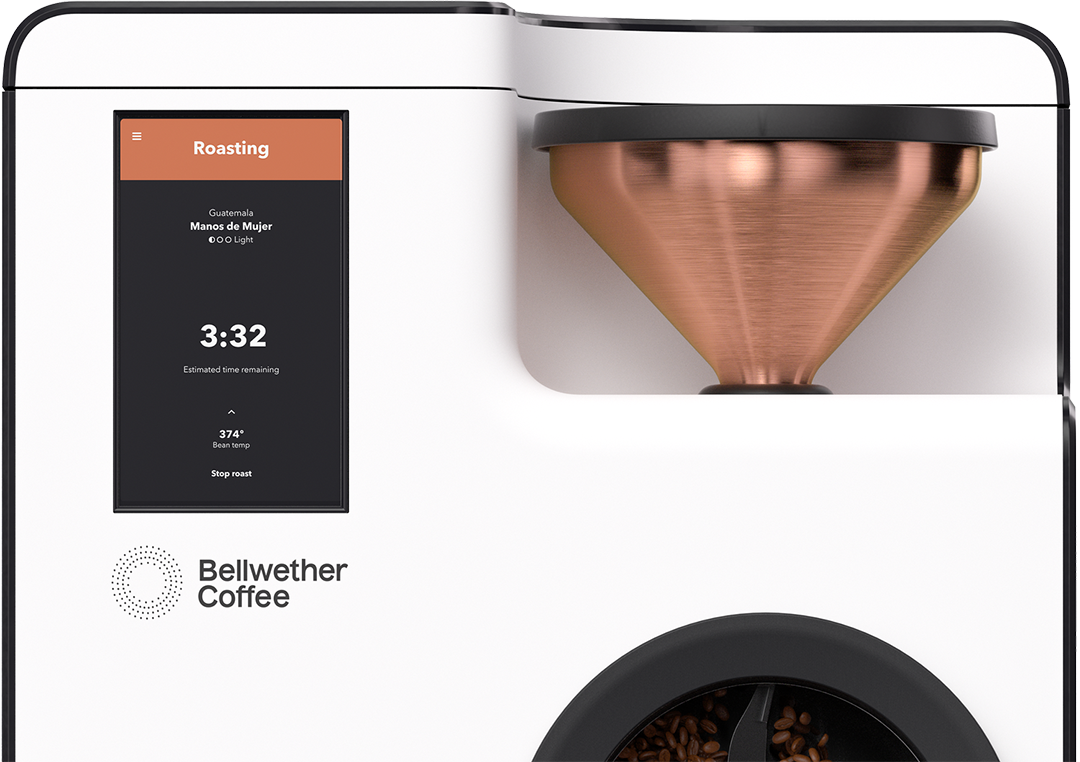 Coffee roasting machine with a digital control panel and coffee beans in a grinder.