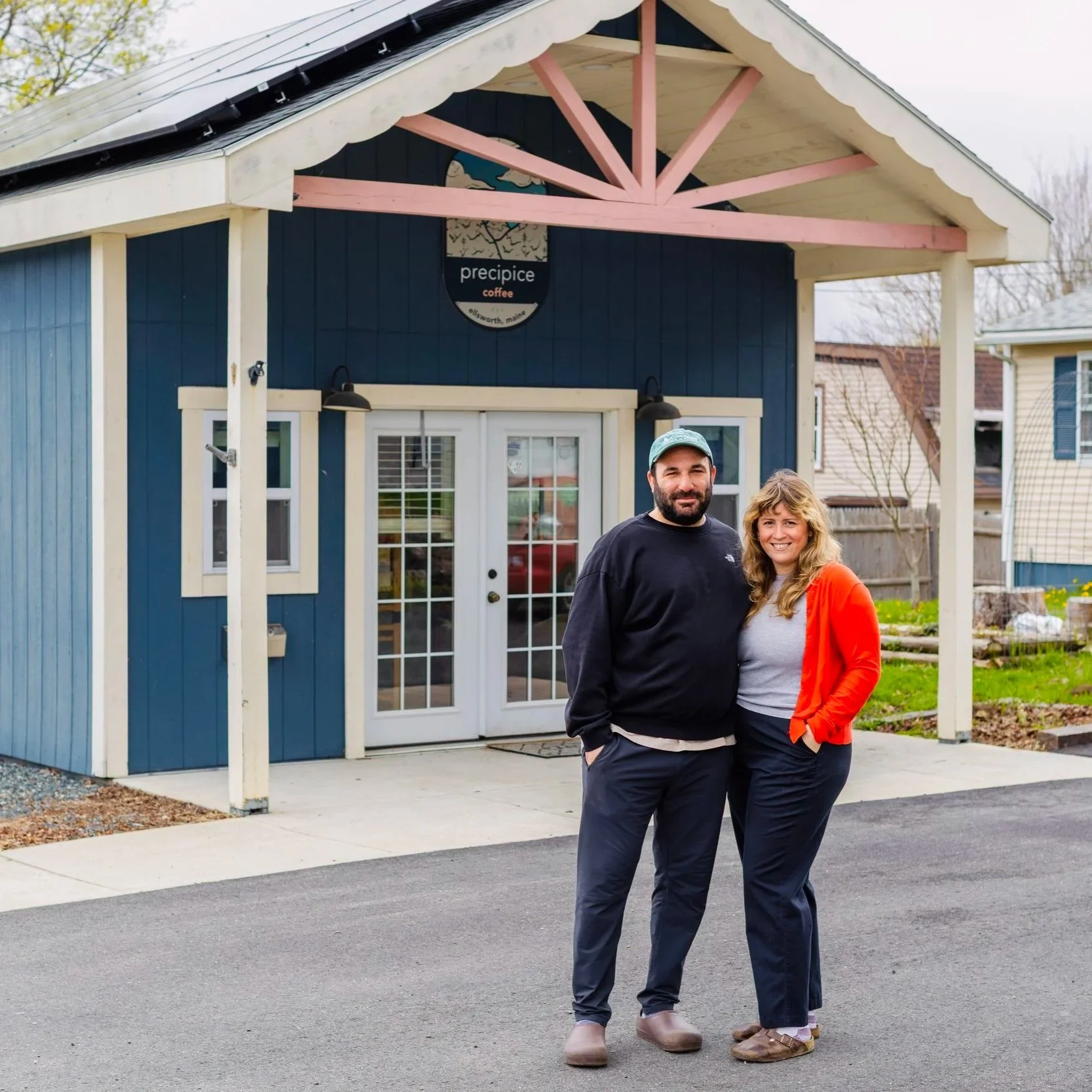 Precipice Coffee co-owners Maggie and Bill standing in front of the tiny shop