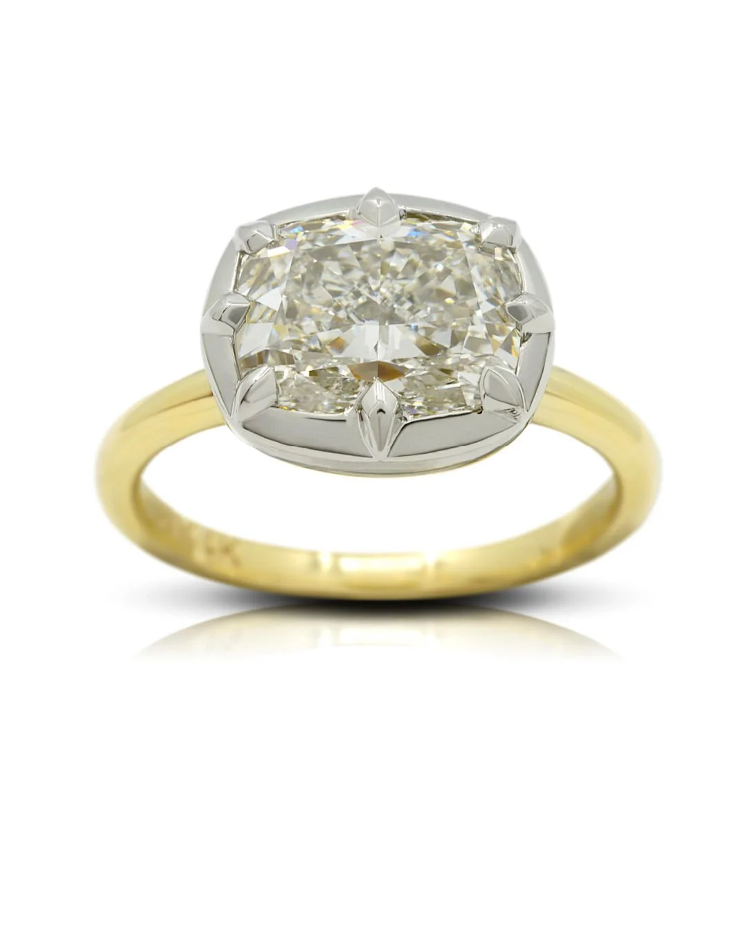 This elongated cushion-cut diamond is set in an East-West style with compass-point claws cradling it in a white gold frame and rising from a slender yellow gold band. Modern minimalism with a touch of grandeur.
.
.
.
.
.
#DixonJewellers #OttawaJewell