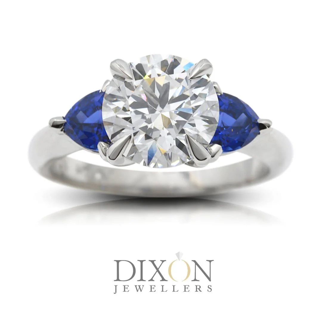 Stunning Three-Stone Engagement Ring with Sapphire Shoulder Stones.jpg