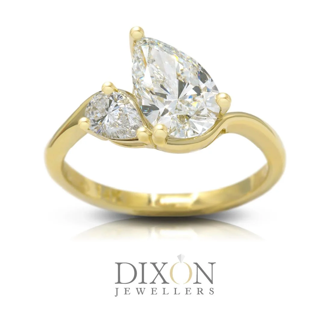 Toi-et-Moi Style Pear Cut Diamond Engagement Ring in Yellow Gold.jpg