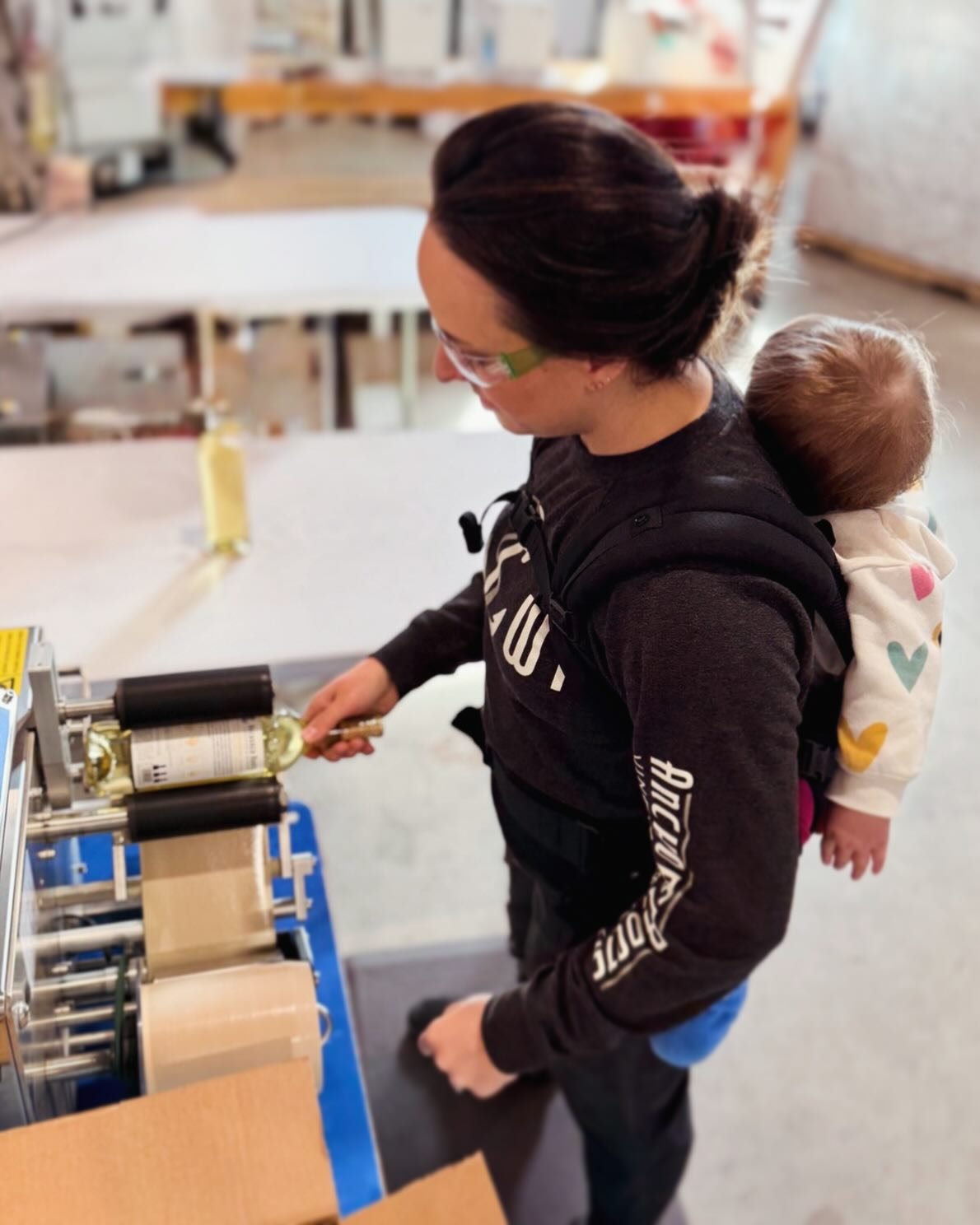 We&rsquo;re a family winery, every step of the way. 

🎬 Behind the scenes of bottling day, our littlest is tucked in for a backpack nap while mom labels wine bottles. 

#familywinery #wisconsinwine #womeninwine #doorcounty #mama 

@doorcountywinetra