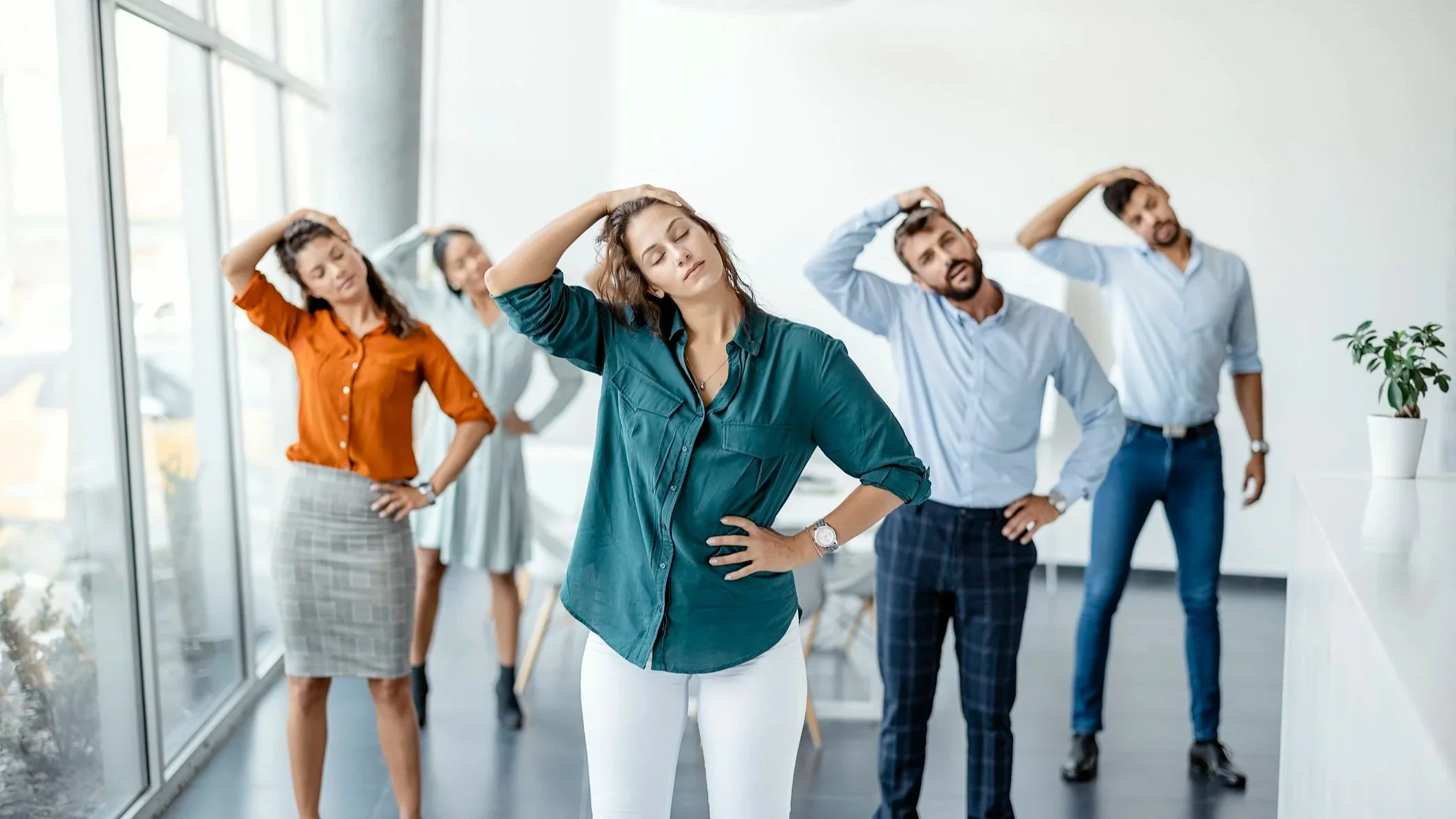 Photo of office employees in a corporate Pilates wellness class