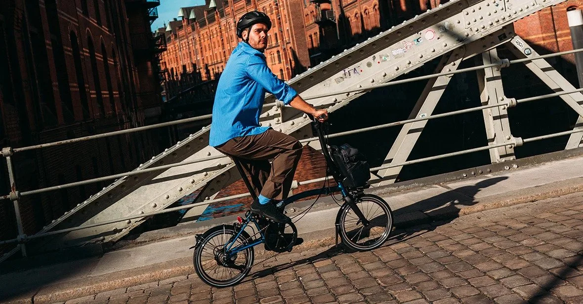 Rider on the Brompton P line Electric Bike in the city setting