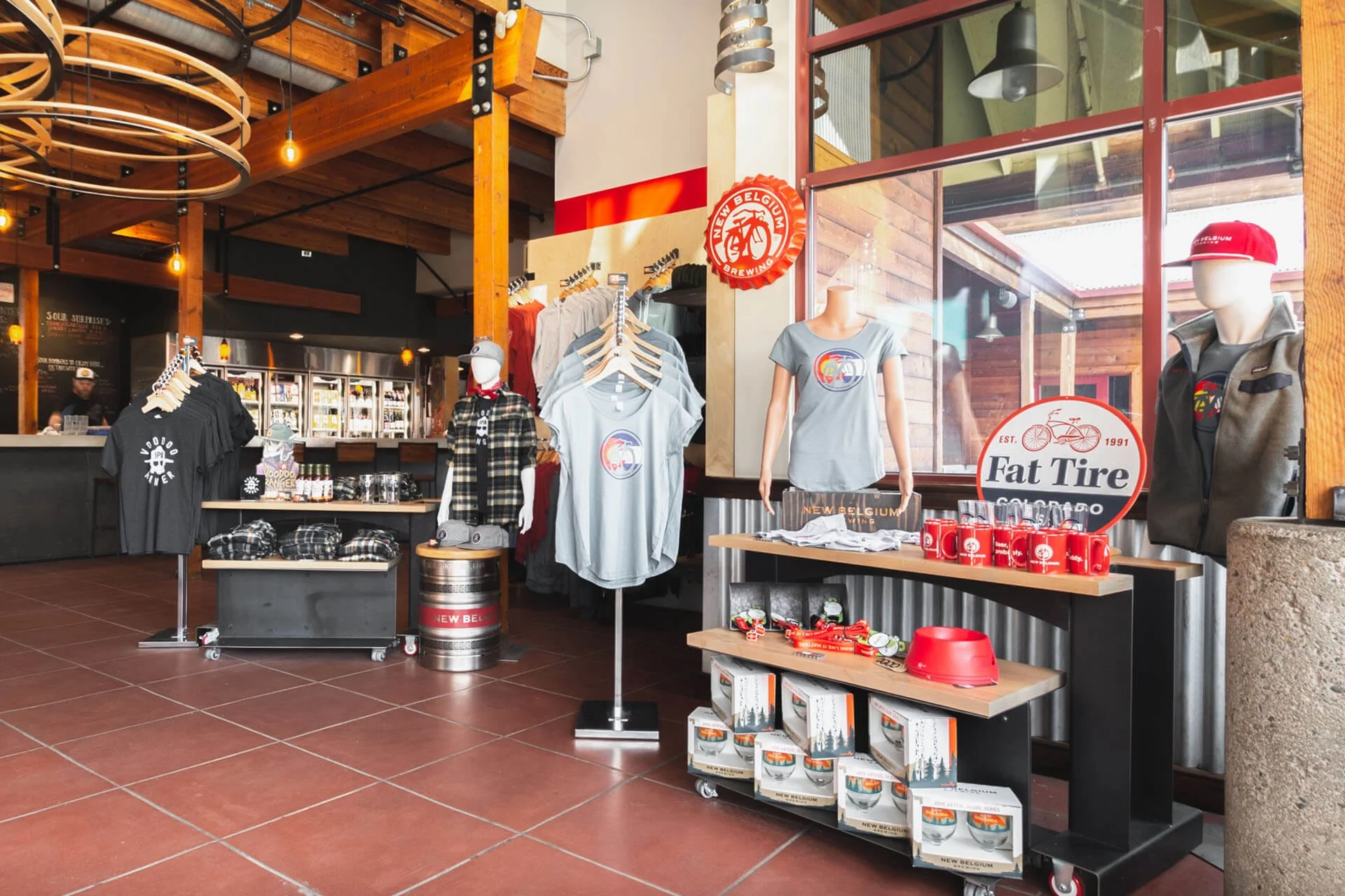 Merchandising area with rolling custom fabricated stands for product at New Belgium in Fort Collins, Coloado.