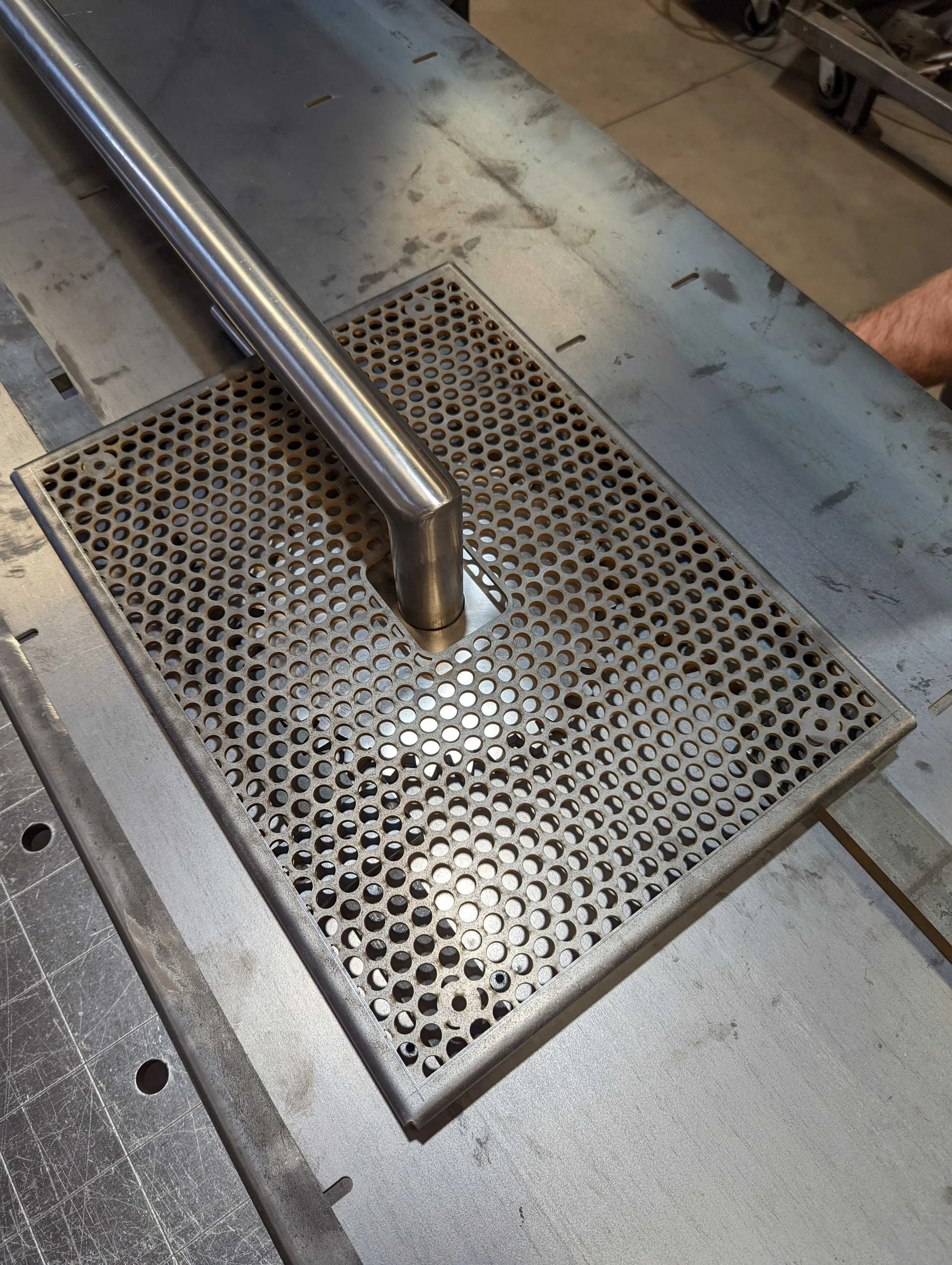 Steel door handle with visible locking mechanism