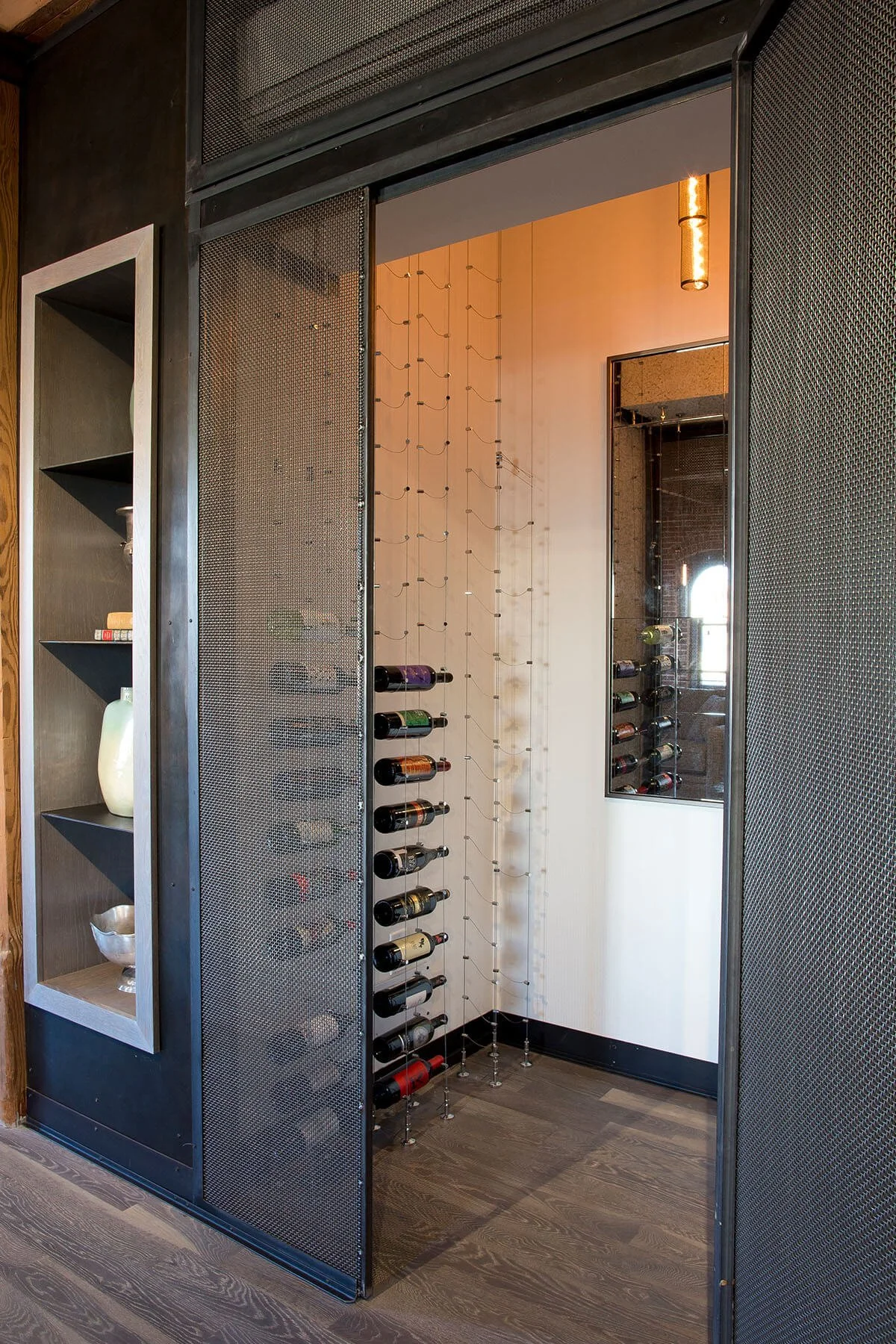 Custom modern industrial wine cellar.
